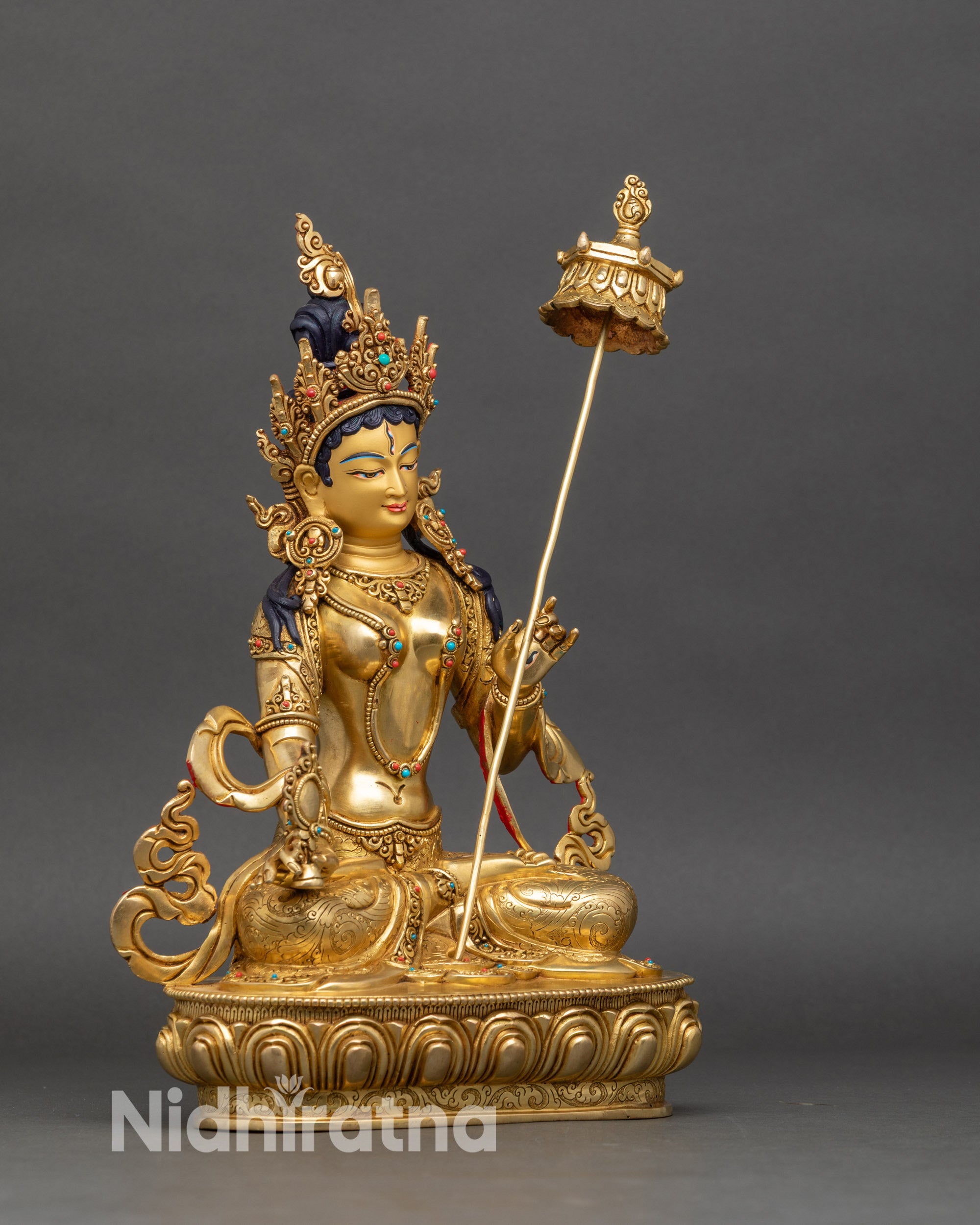 Right profile of Dukar statue, seated White Umbrella Goddess with ritual parasol