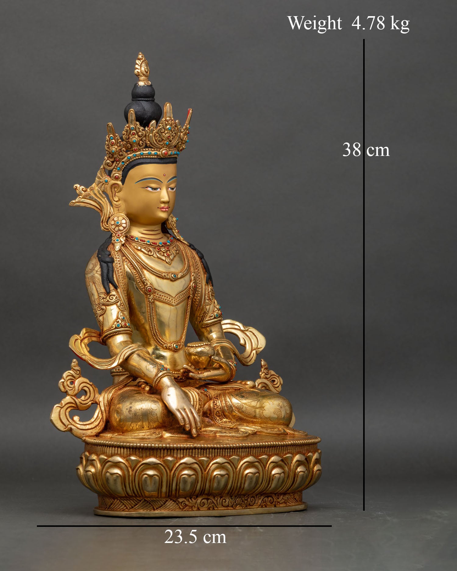 Right profile of crowned Shakyamuni Buddha statue with crown and detailed ornaments