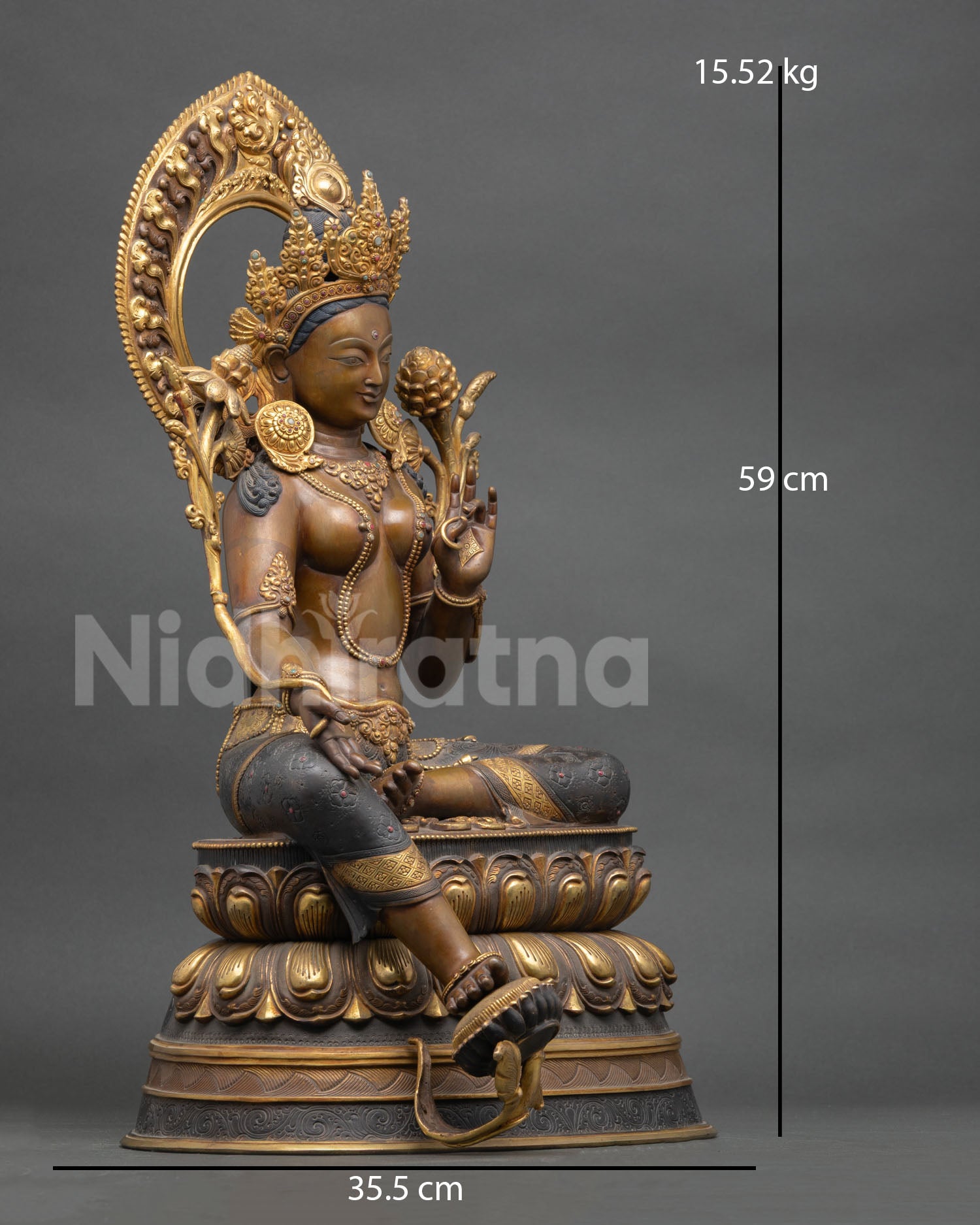 Right side view Green Tara statue, extended leg, lotus throne, copper gilding