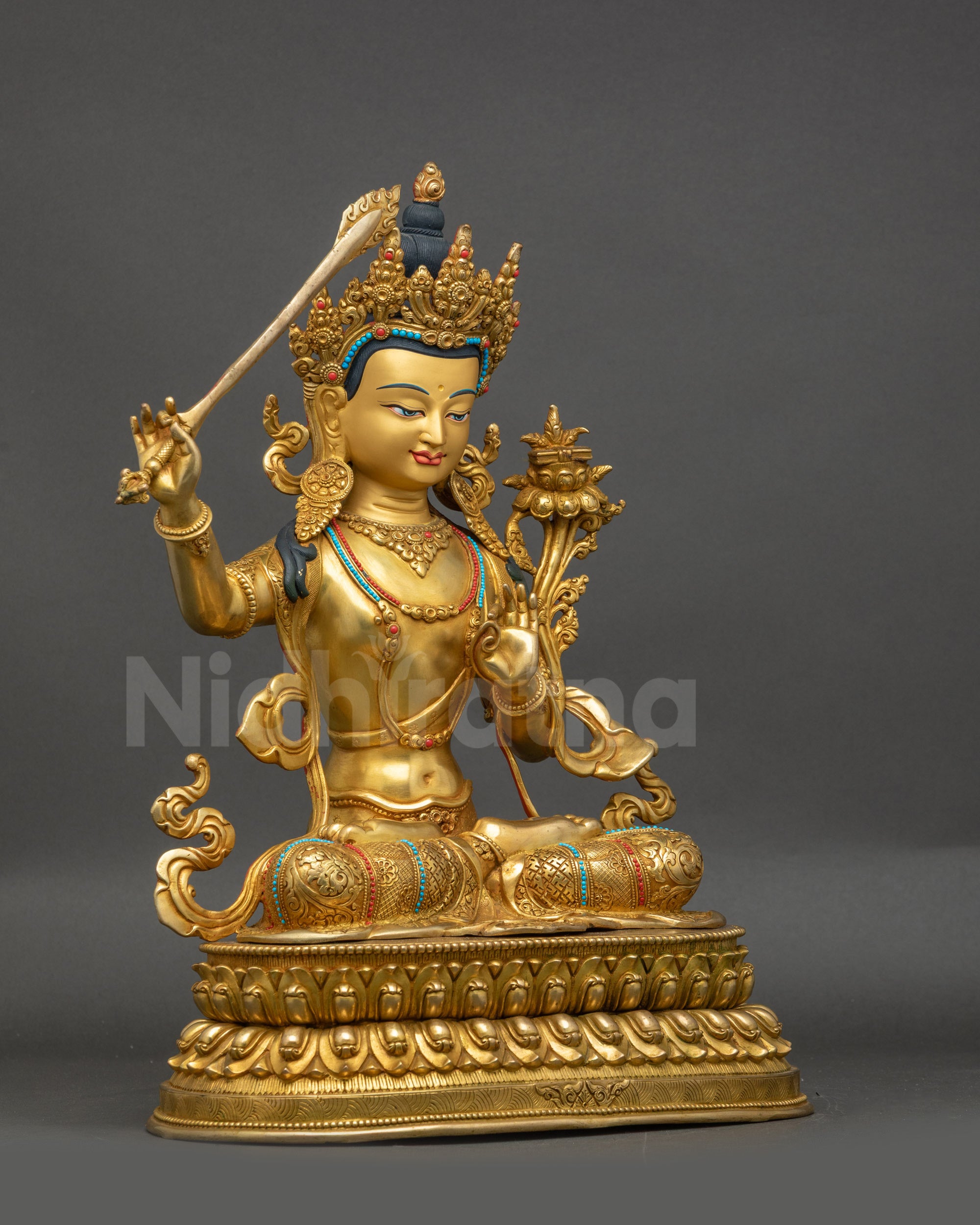Right-side view of Bodhisattva Manjushri holding utpala stem and double-edged sword