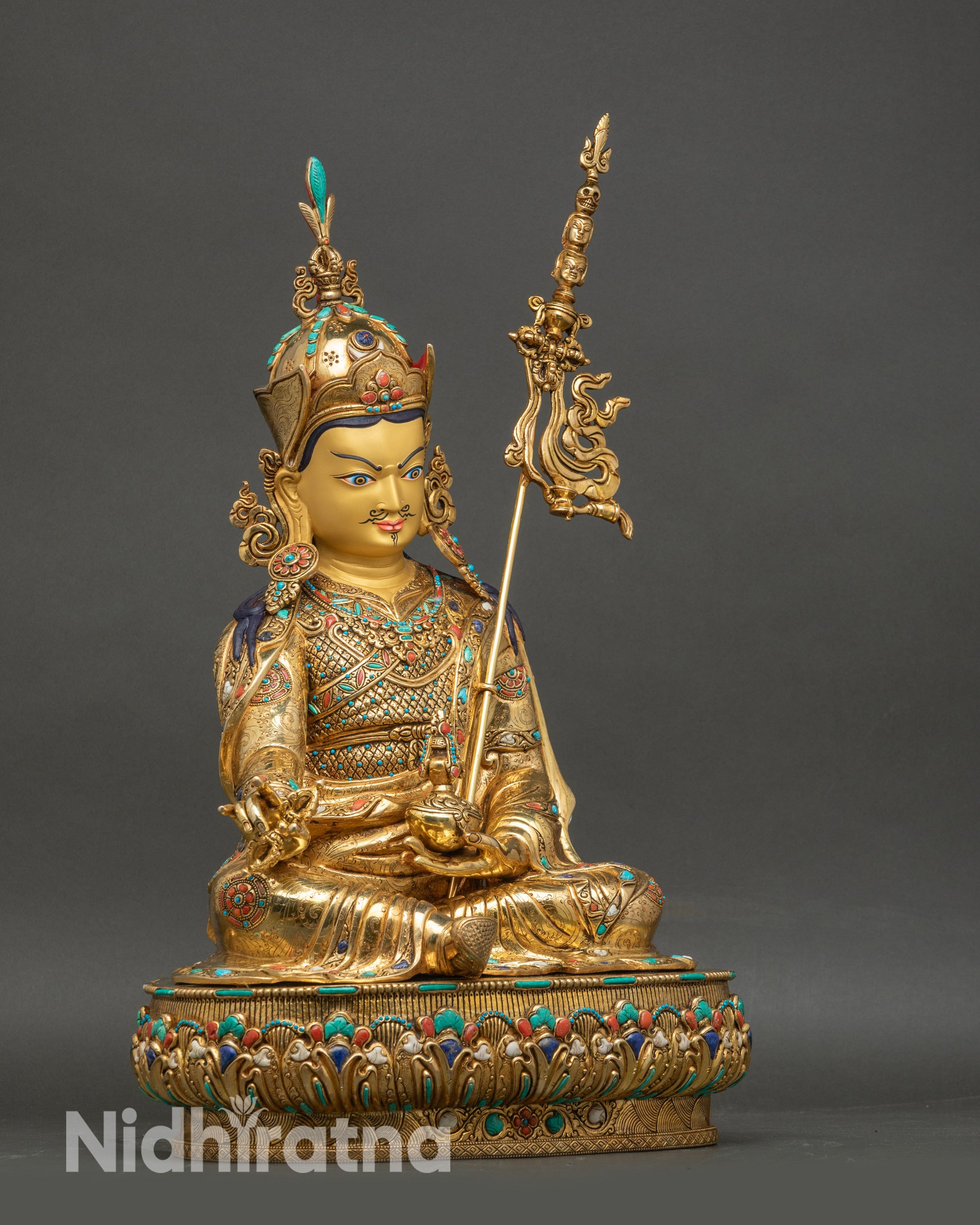 Right profile of Padmasambhava statue, copper craftsmanship, gold fire-gilding, and semi-precious stone embellishments