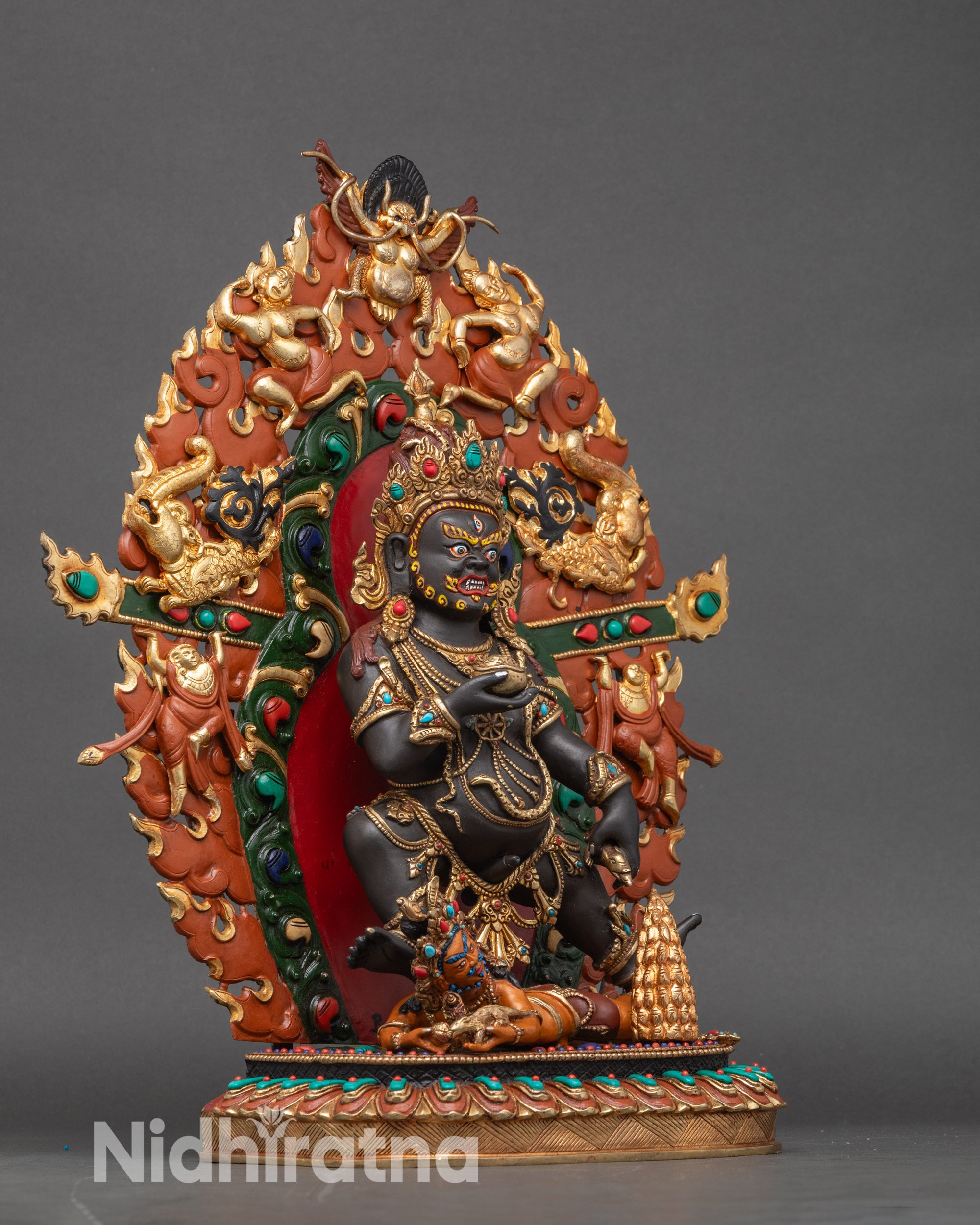 Right profile of Black Dzambhala statue, handcrafted Nepalese Buddhist art