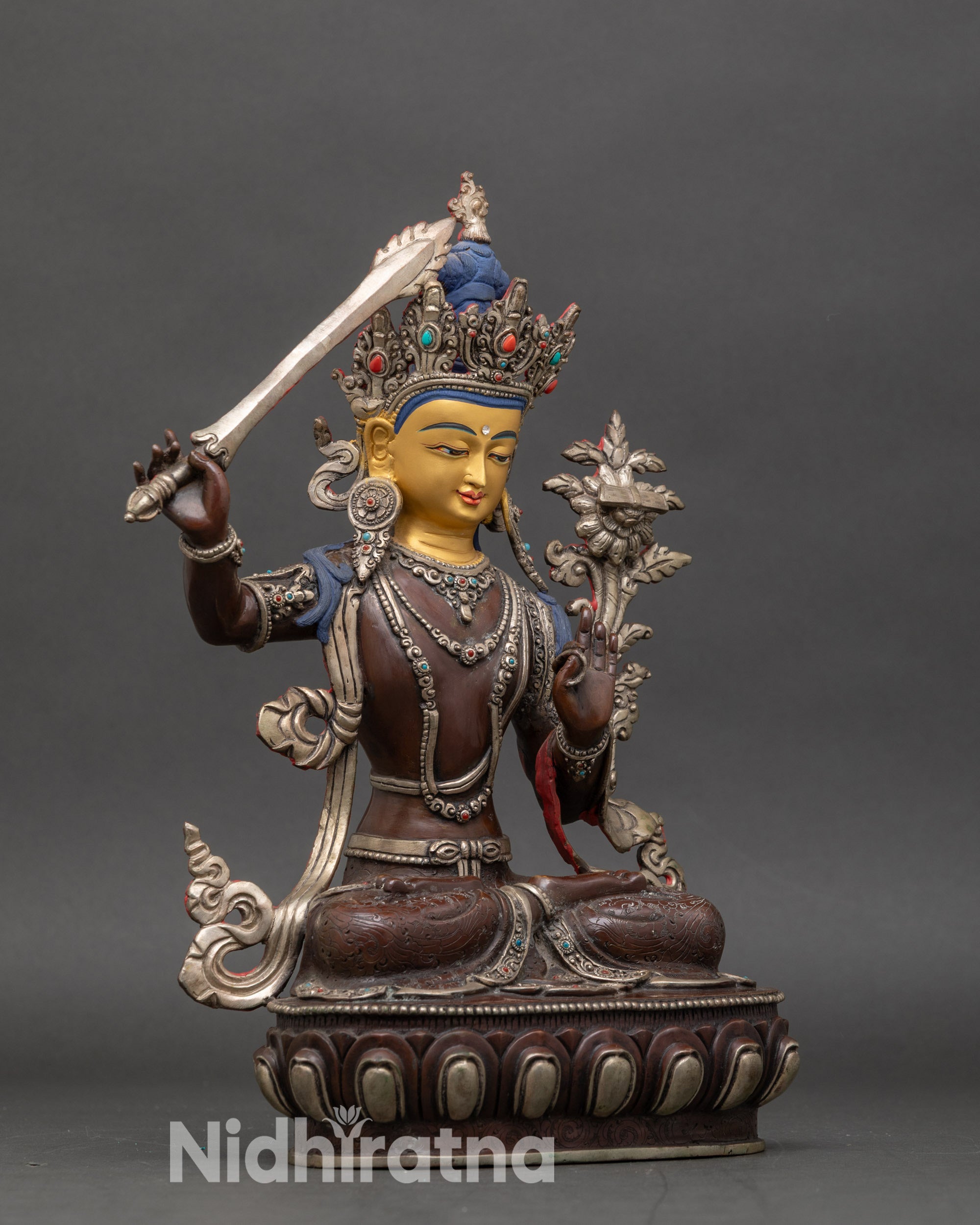 Right profile of Bodhisattva Manjushri statue seated on lotus pedestal