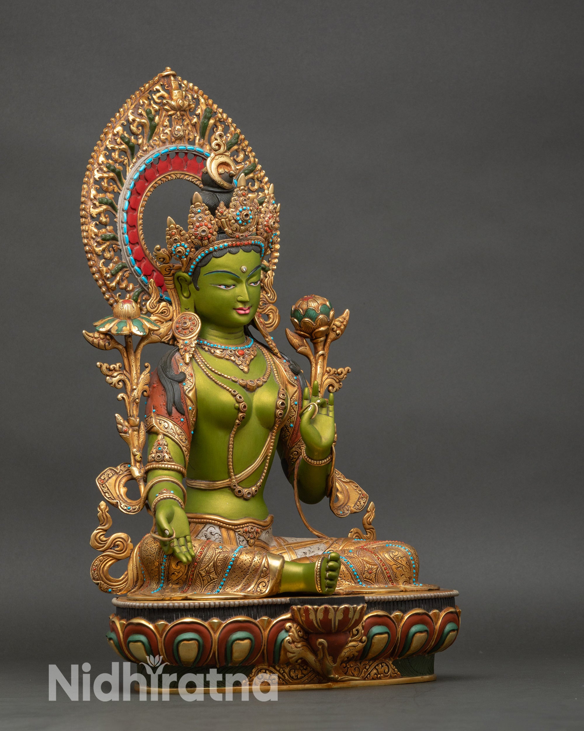 Right profile of Green Tara Bodhisattva, hand-painted green and gilded