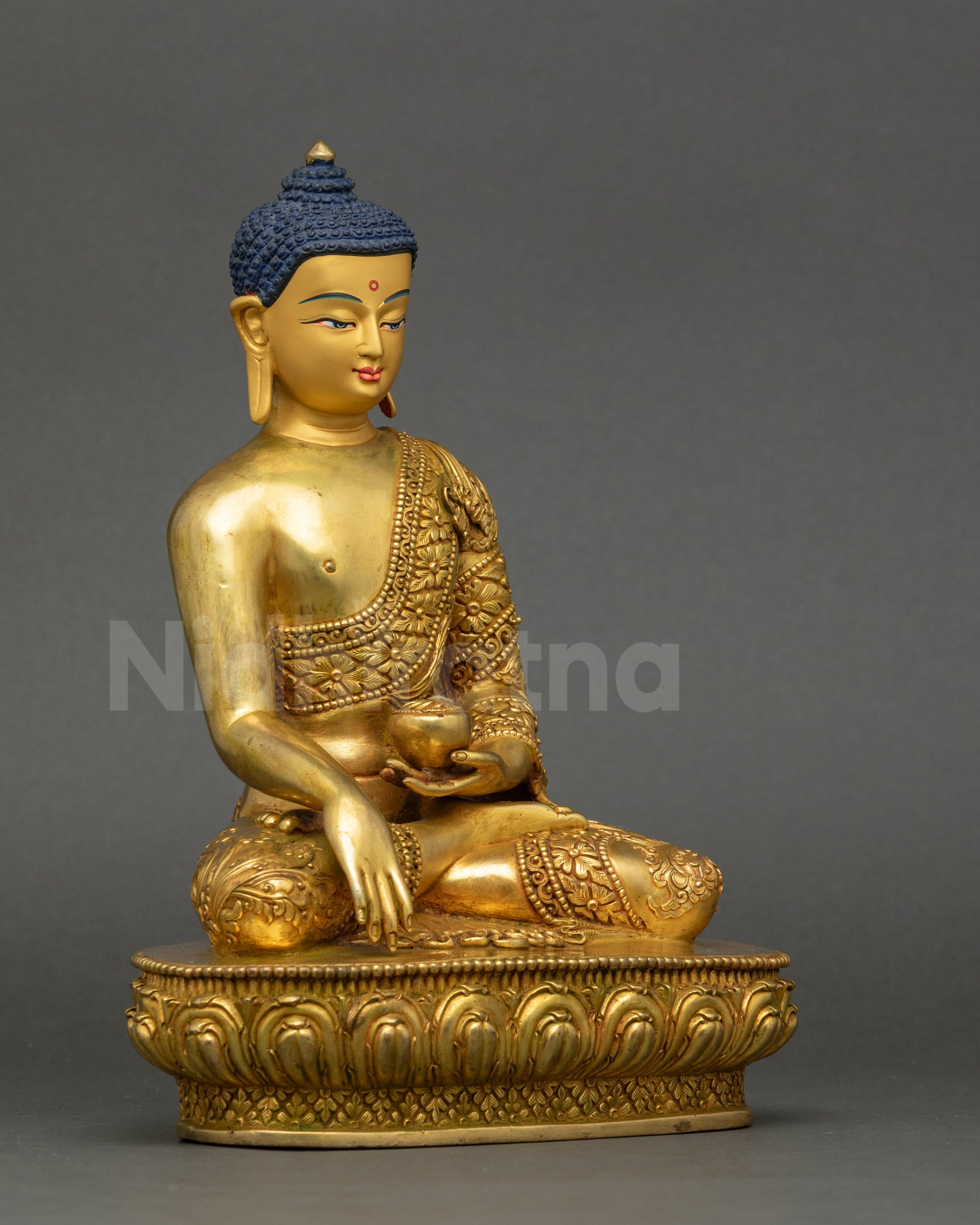 Right profile of Shakyamuni Buddha performing earth-touching mudra