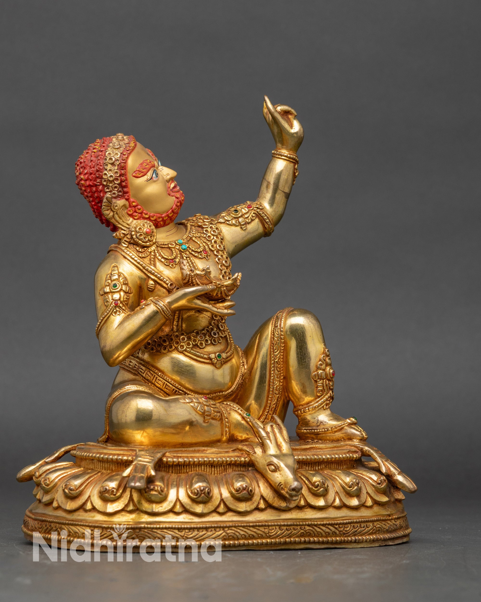 Right profile of Virupa statue showing raised hand and lotus seat details