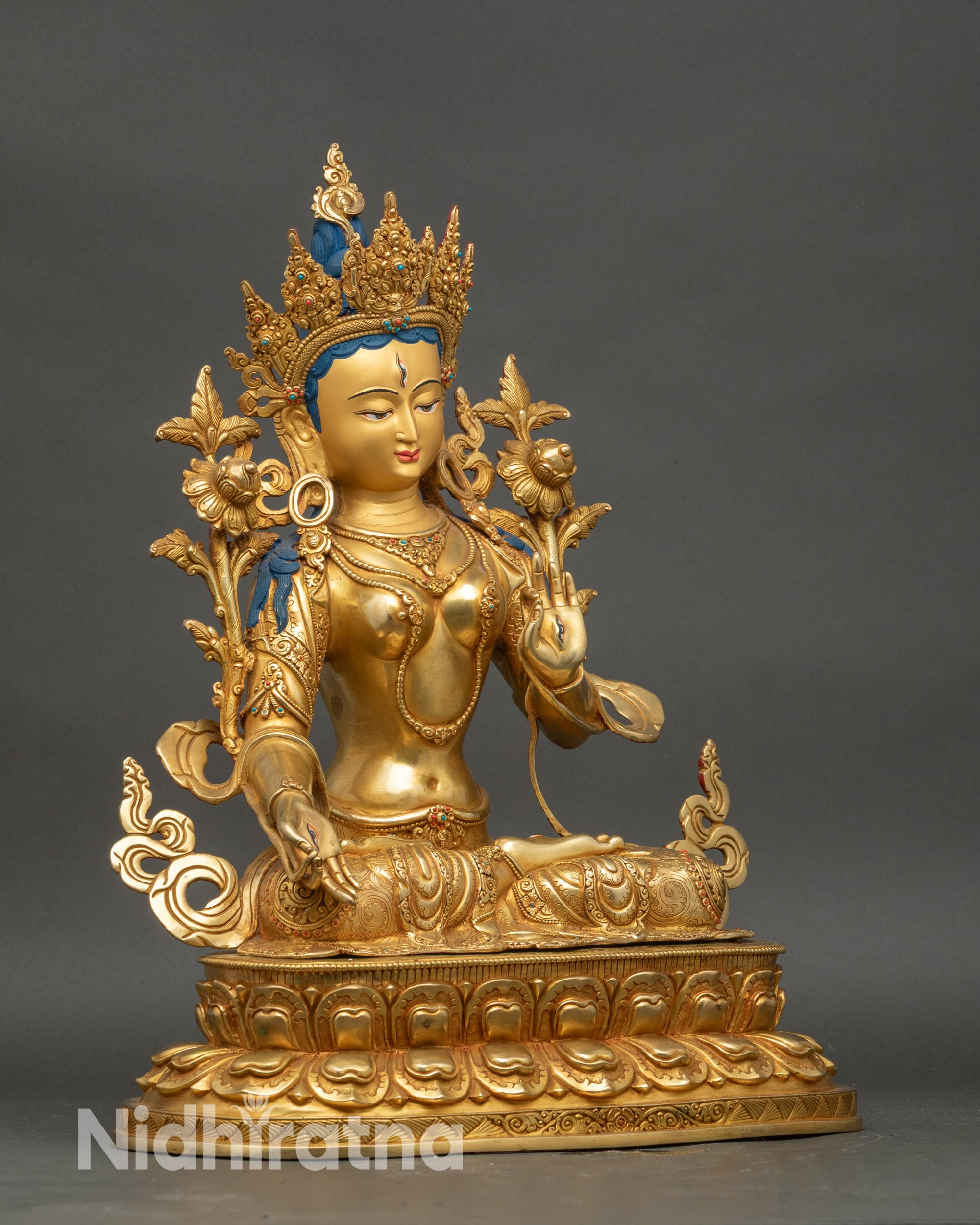 Right profile of White Tara statue, lotus throne, hand-painted gold accents