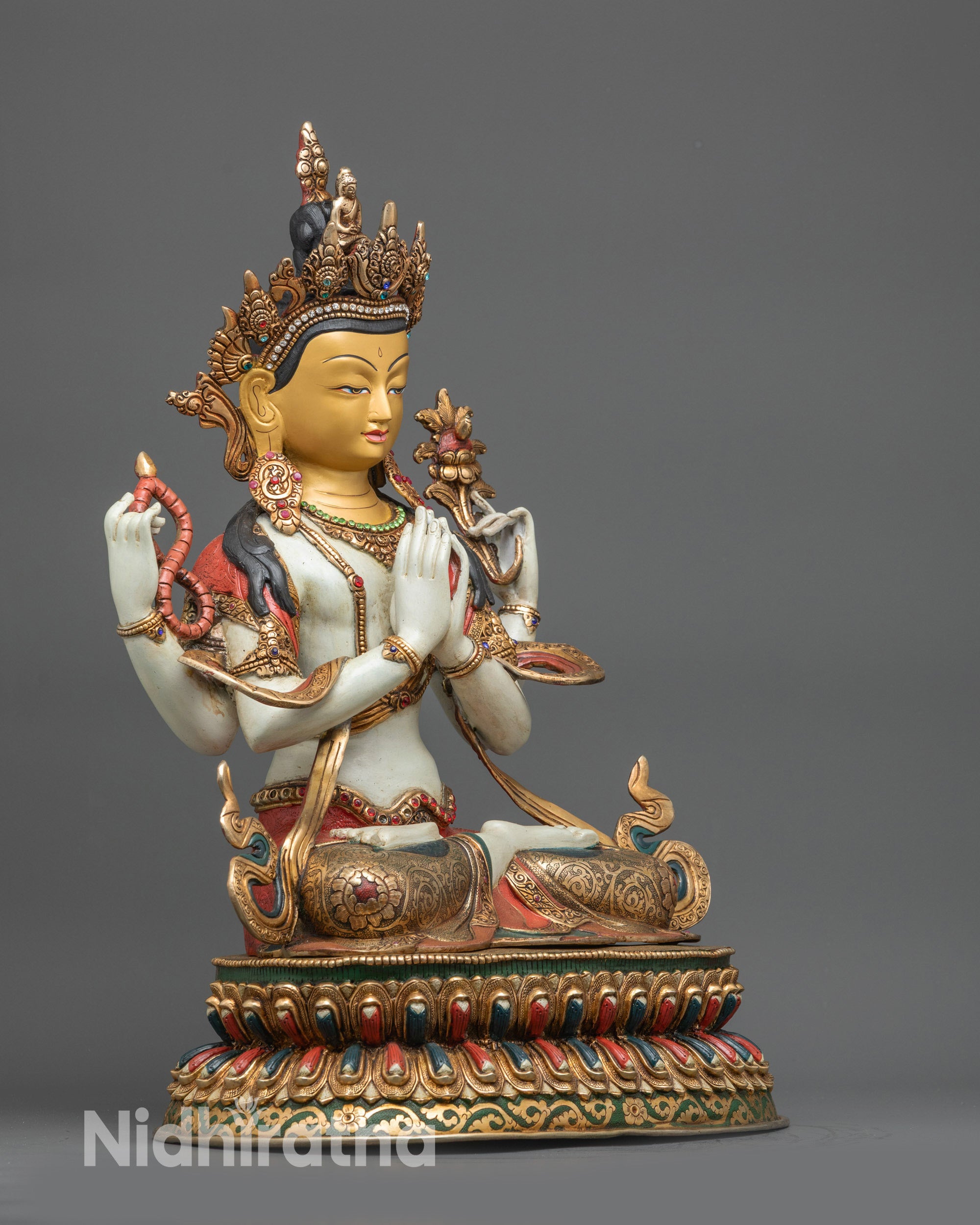 Right side view Chenrezig statue with gold-gilded face and floating gold-plated robe