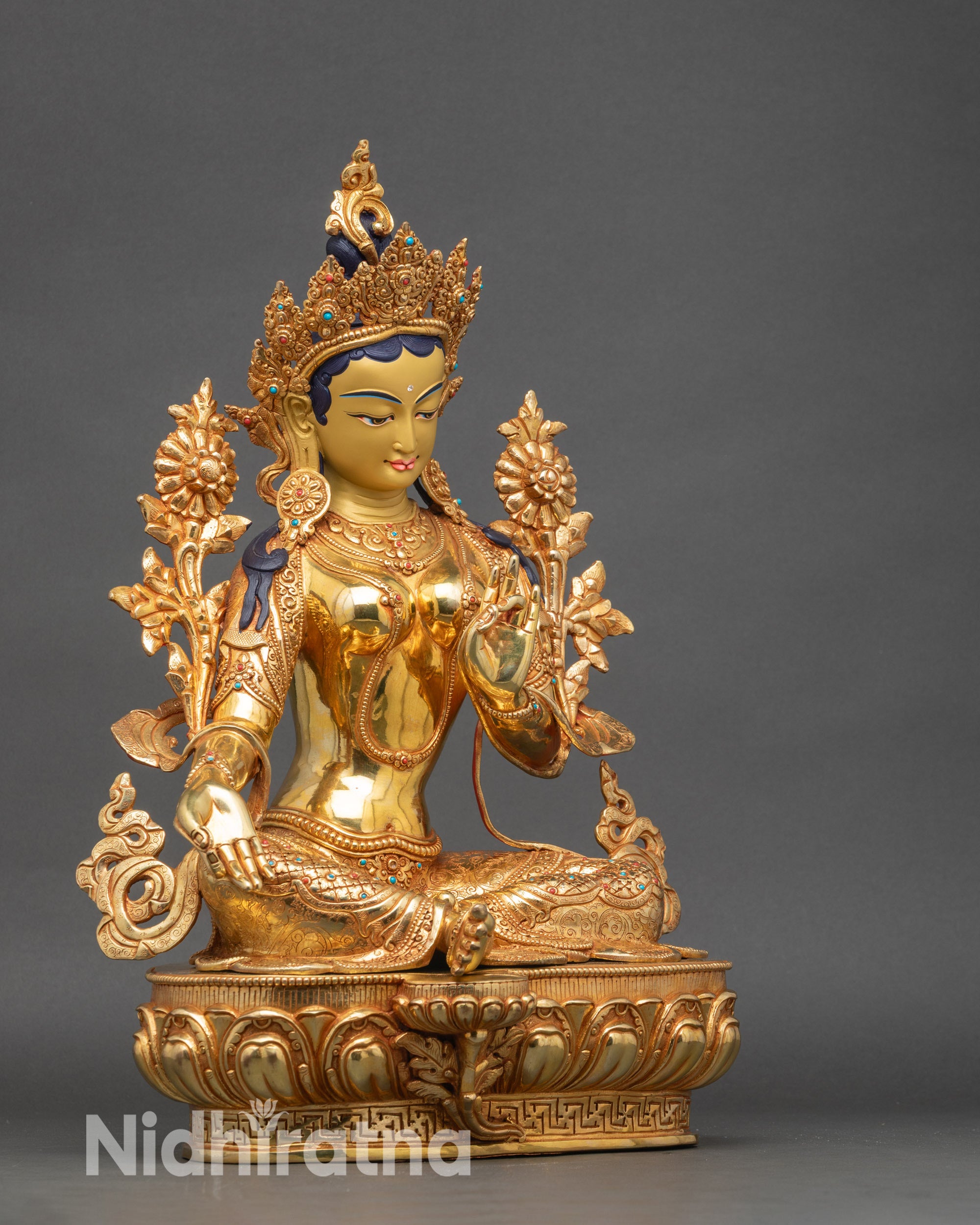 Right side view of Green Tara sculpture capturing elegant seated posture and intricate design