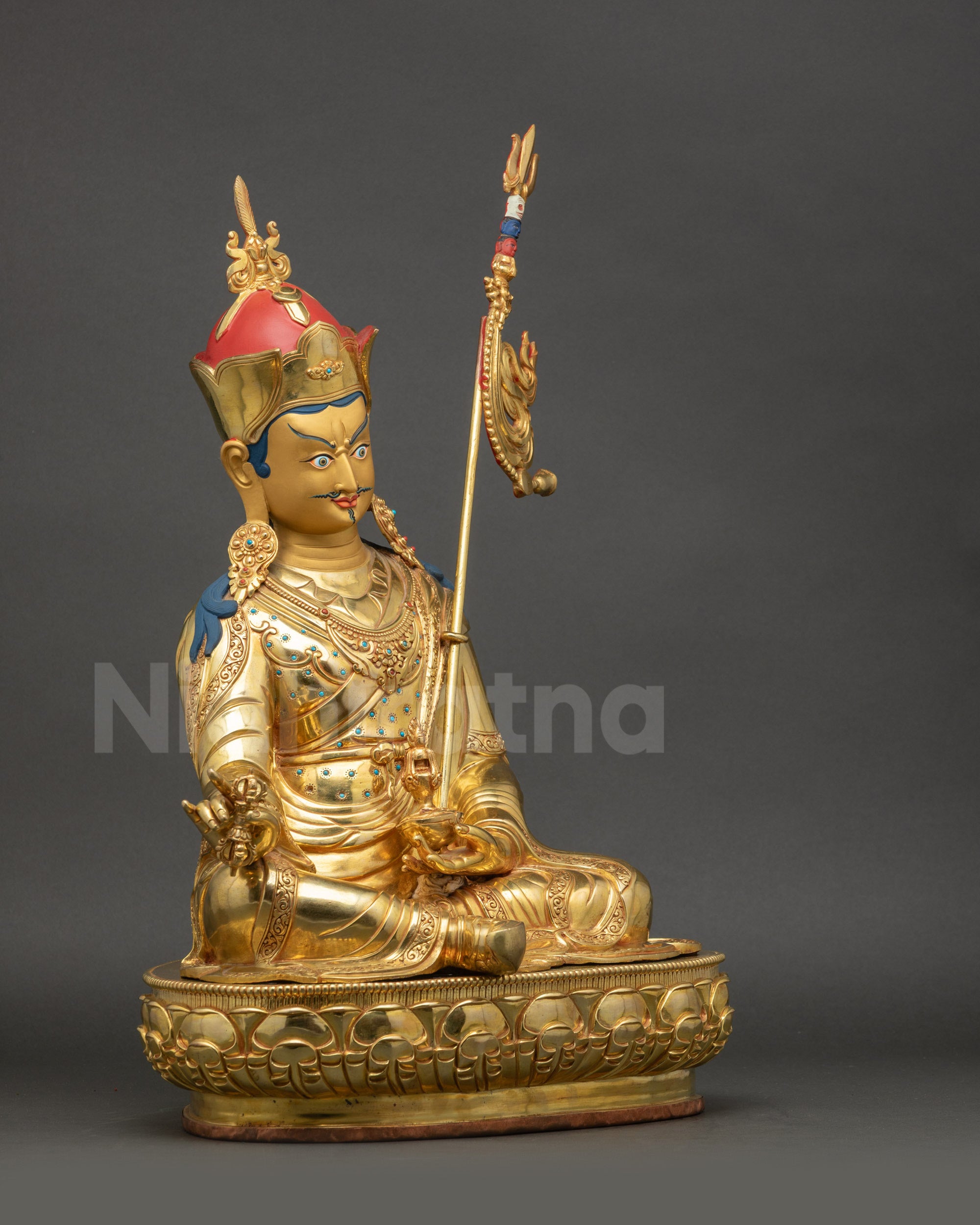 Right side view of Guru Rinpoche Statue displaying hand-painted lotus hat and layered robes