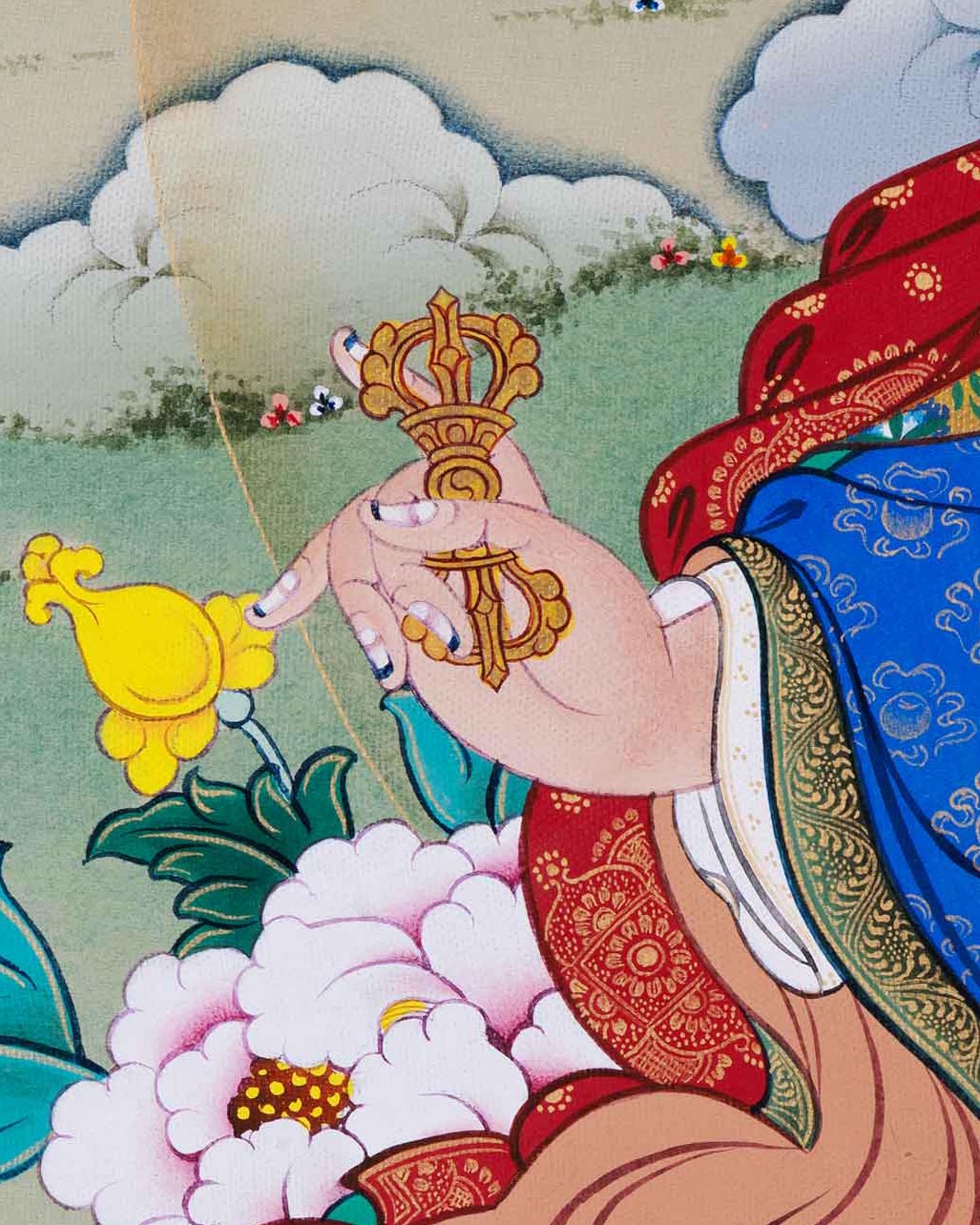 Right side view of Guru Rinpoche holding vajra, skull cup, and khatvanga in Thangka art