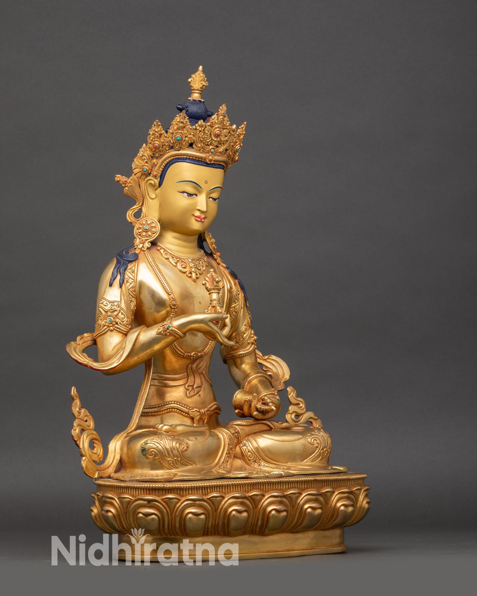 Right side view of Purification Lord Dorje Sempa copper statue, lotus pedestal, gold accents