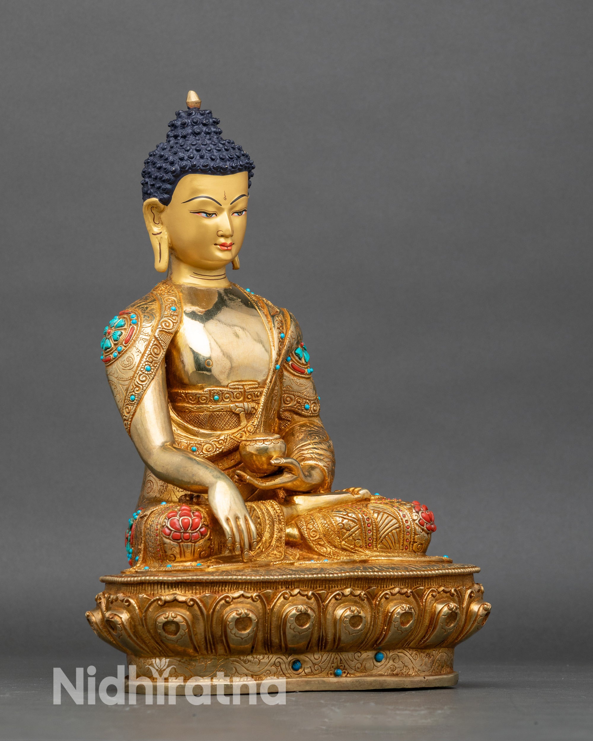 Right side view of Shakyamuni Buddha statue seated on lotus pedestal with carved robe patterns