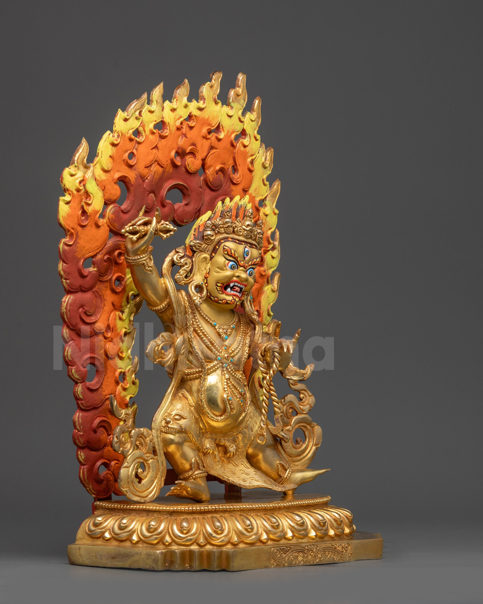 Right side view of Vajrapani holding vajra and lasso symbolizing protection