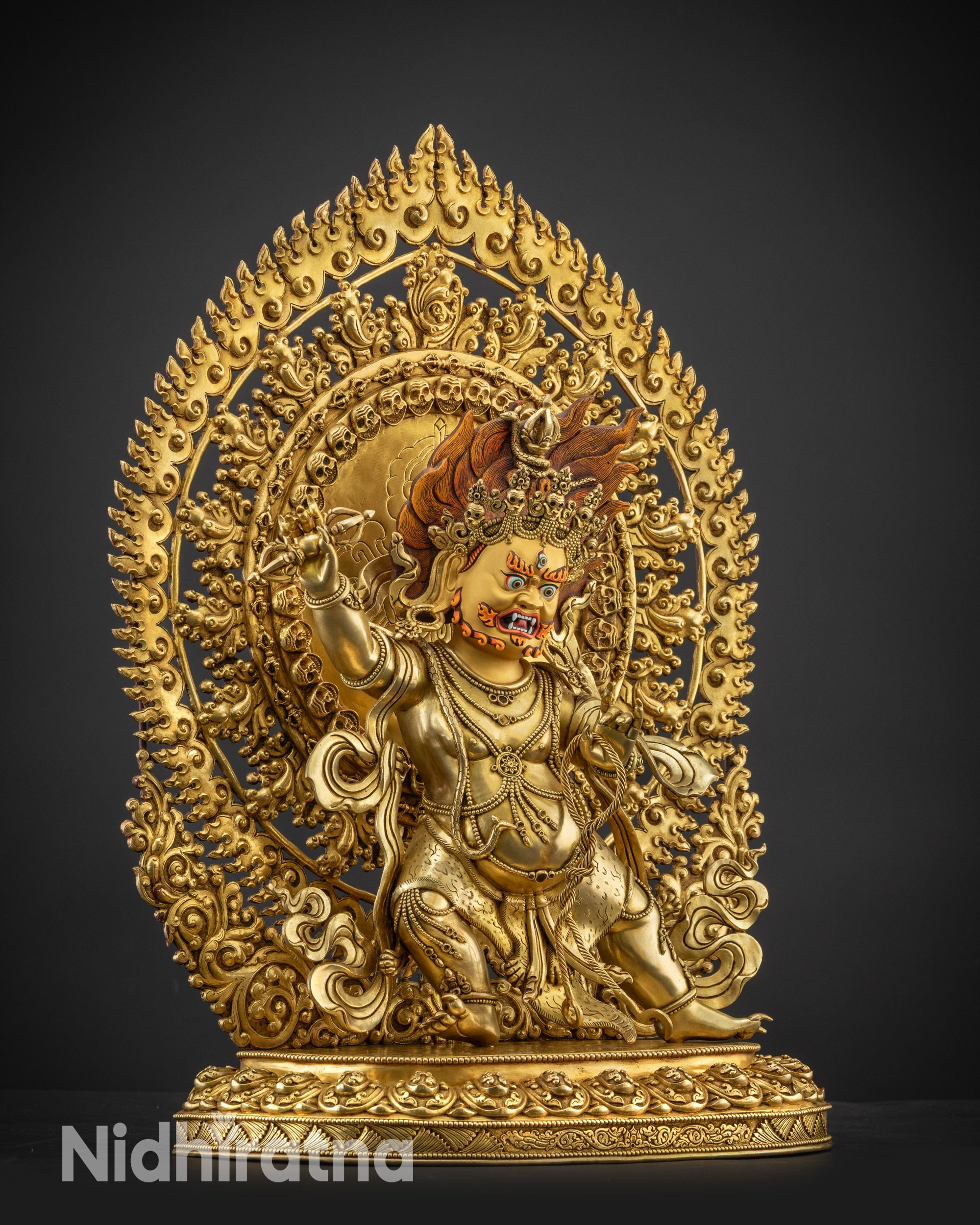 Right side view of Vajrapani statue with serpent wrapped around body