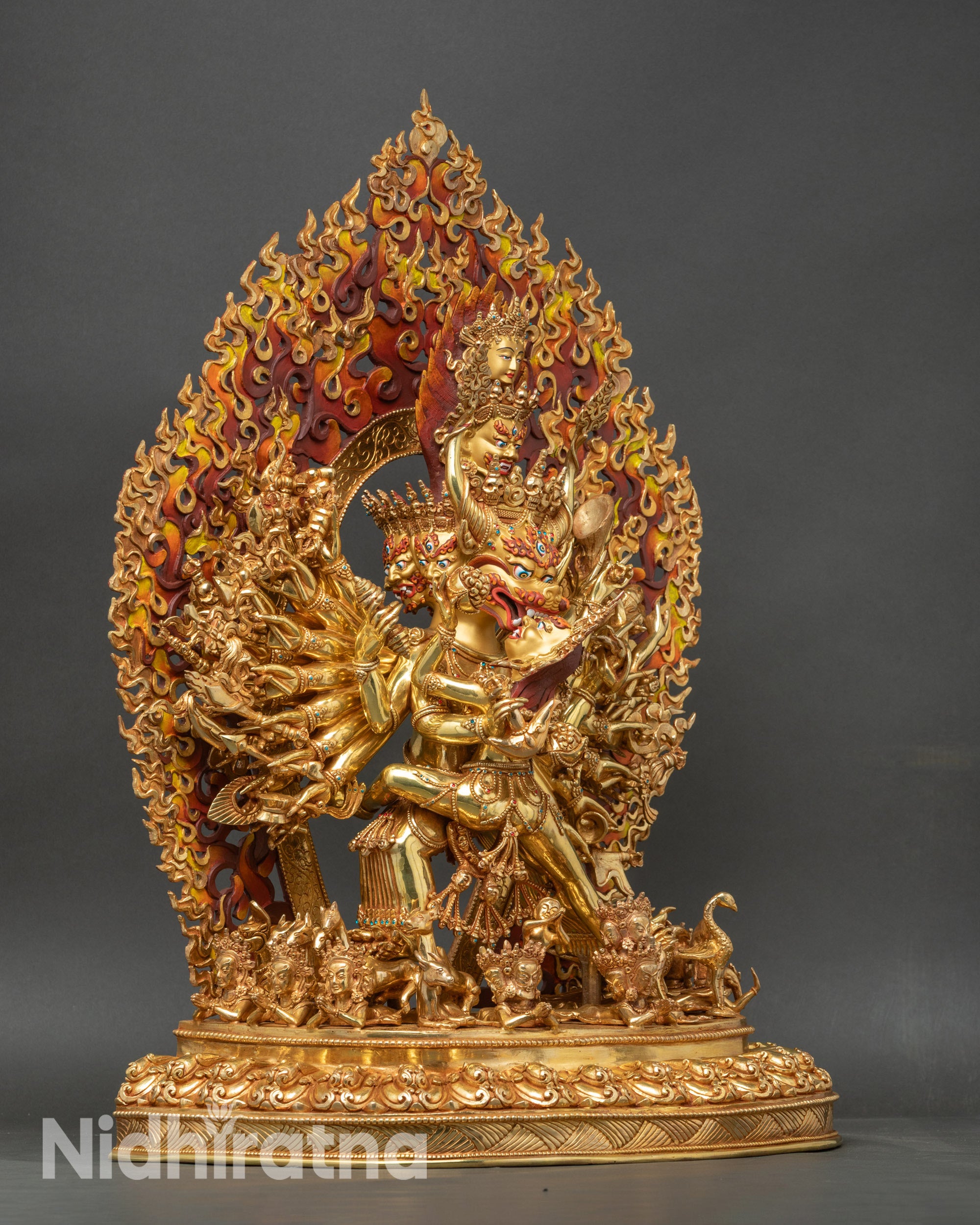 Right side view of Yamantaka union statue with multiple arms and ritual objects