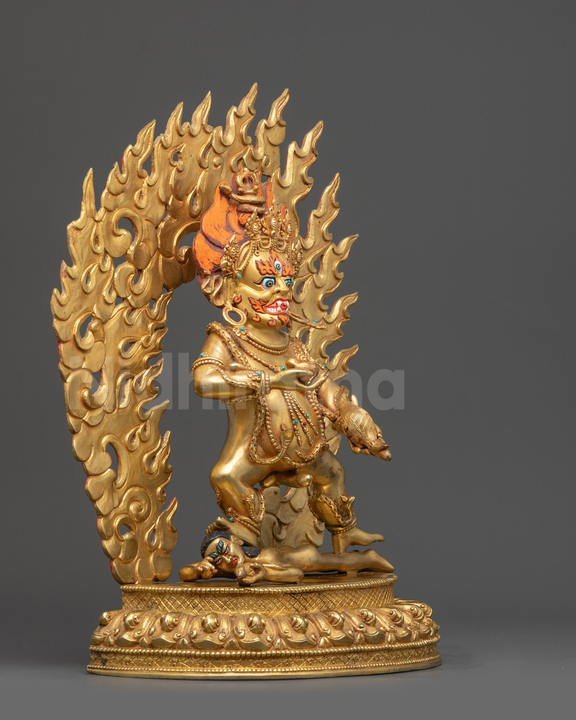 Right view side Black Dzambhala Statue standing over subdued evil deity