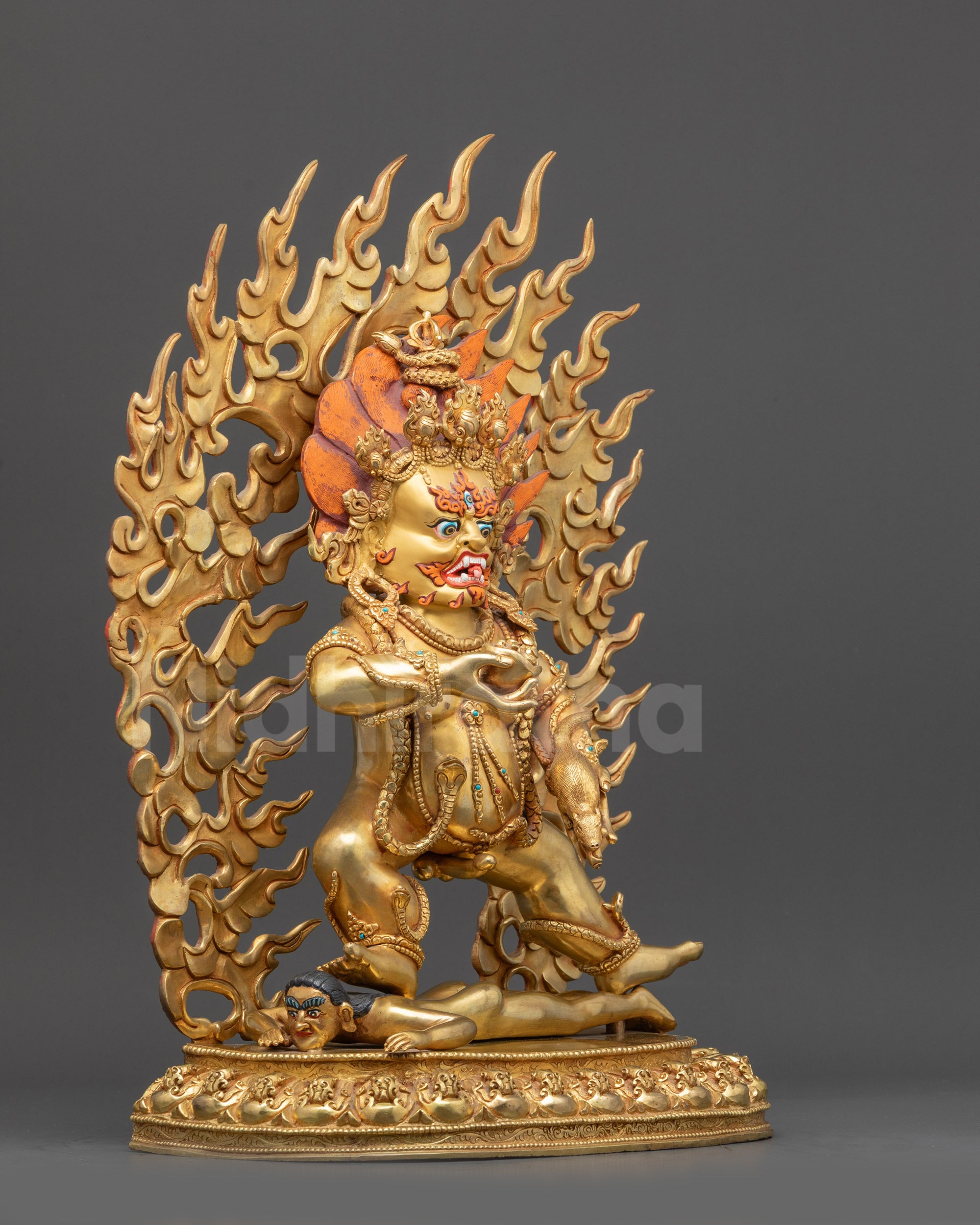 Right view side Black Dzambhala statue holding kapala and jeweled spitting mongoose