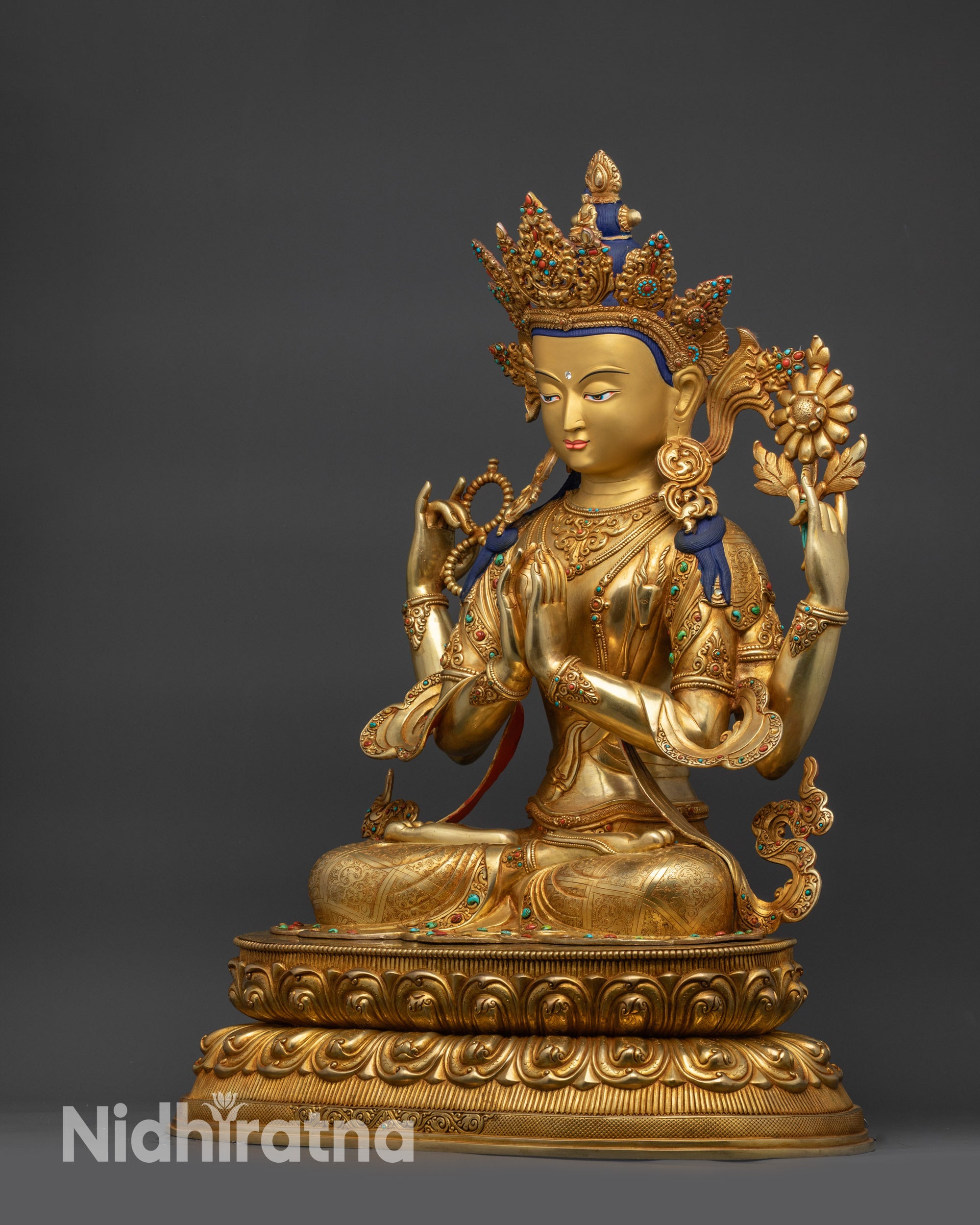 Right view side Chenrezig Buddha sculpture on double-layered lotus meditation seat