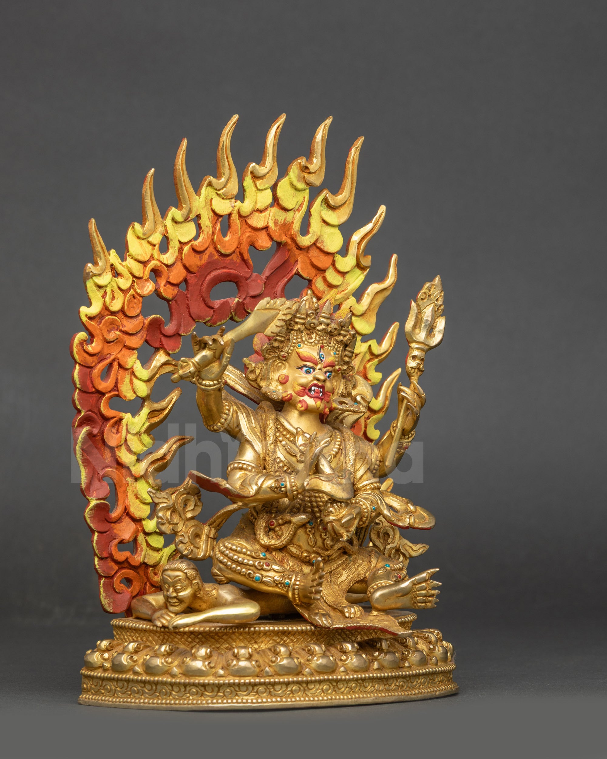 Right view side Four-Armed Mahakala statue holding wisdom sword trishul