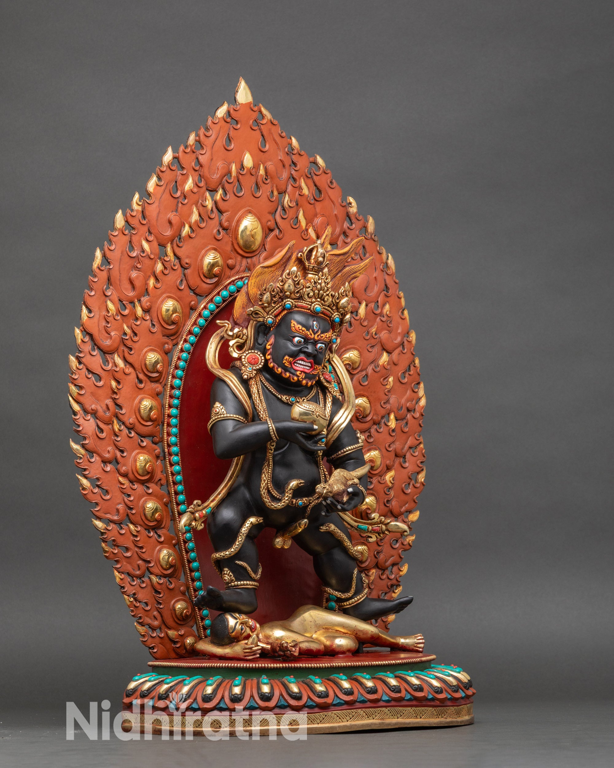 Right view side – Right profile of Black Dzambhala statue, copper and gold ritual deity of abundance