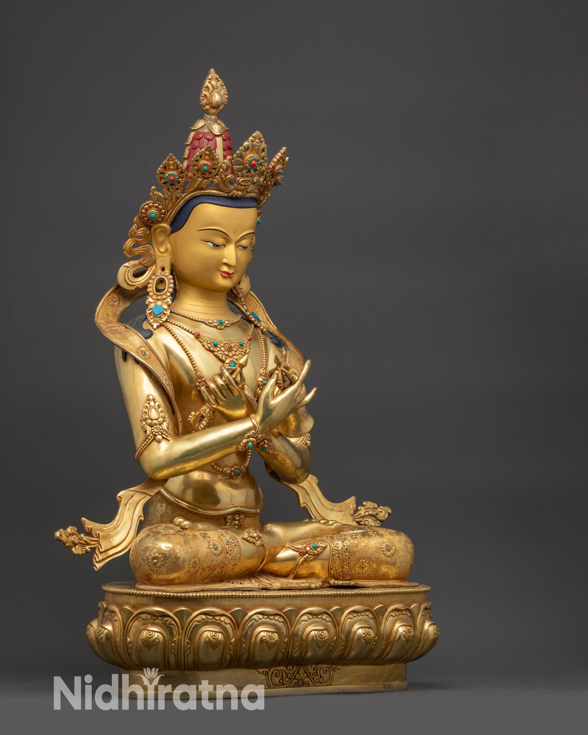 Right view side Vajradhara statue displaying carved lotus ornaments and floating robe