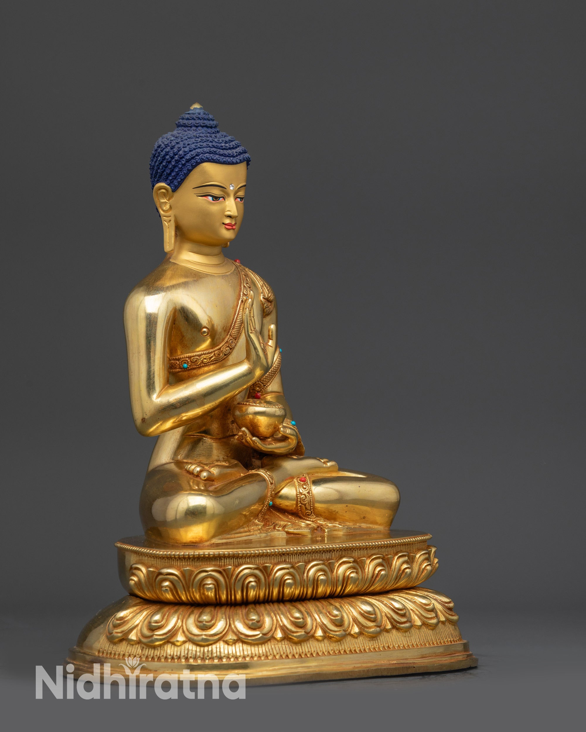Right view side of Amoghasiddhi Buddha statue showing abhaya mudra and lotus pedestal
