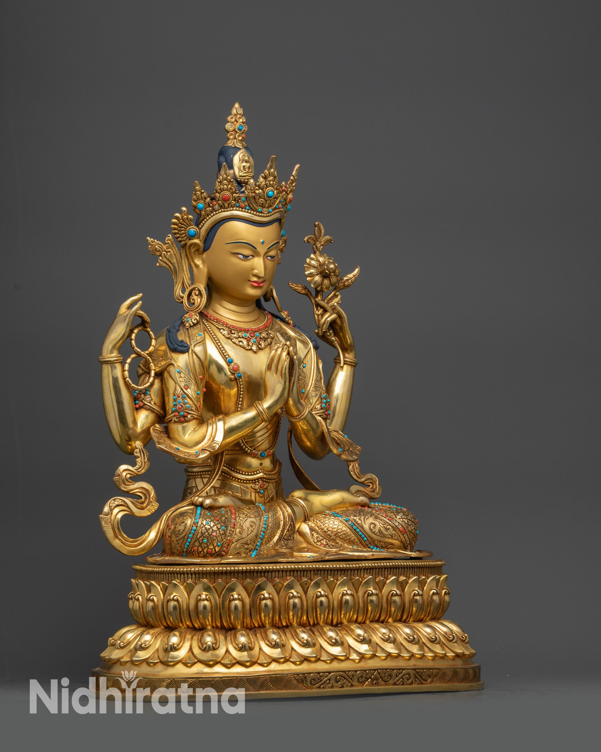 Right view side of Chenrezig statue holding wish-fulfilling jewel and crystal mala