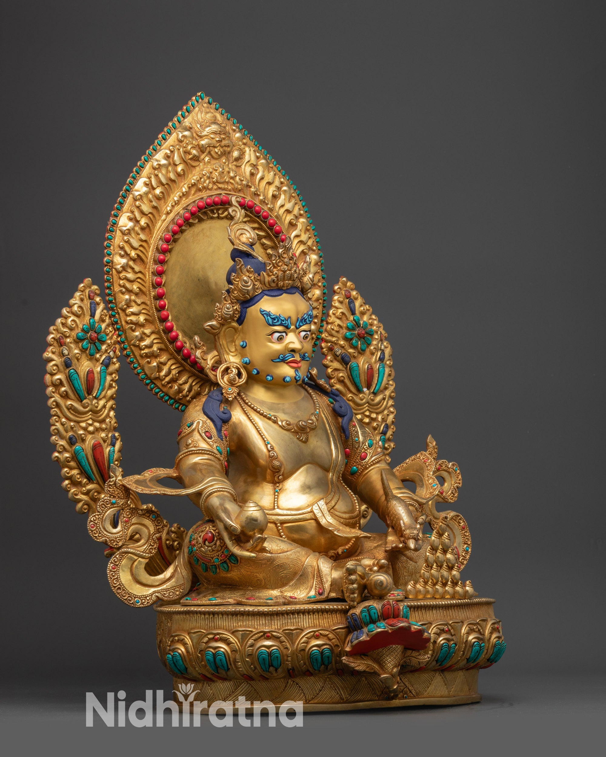 Right view side of Dzambhala Sculpture showing gem-spouting mongoose and citron fruit