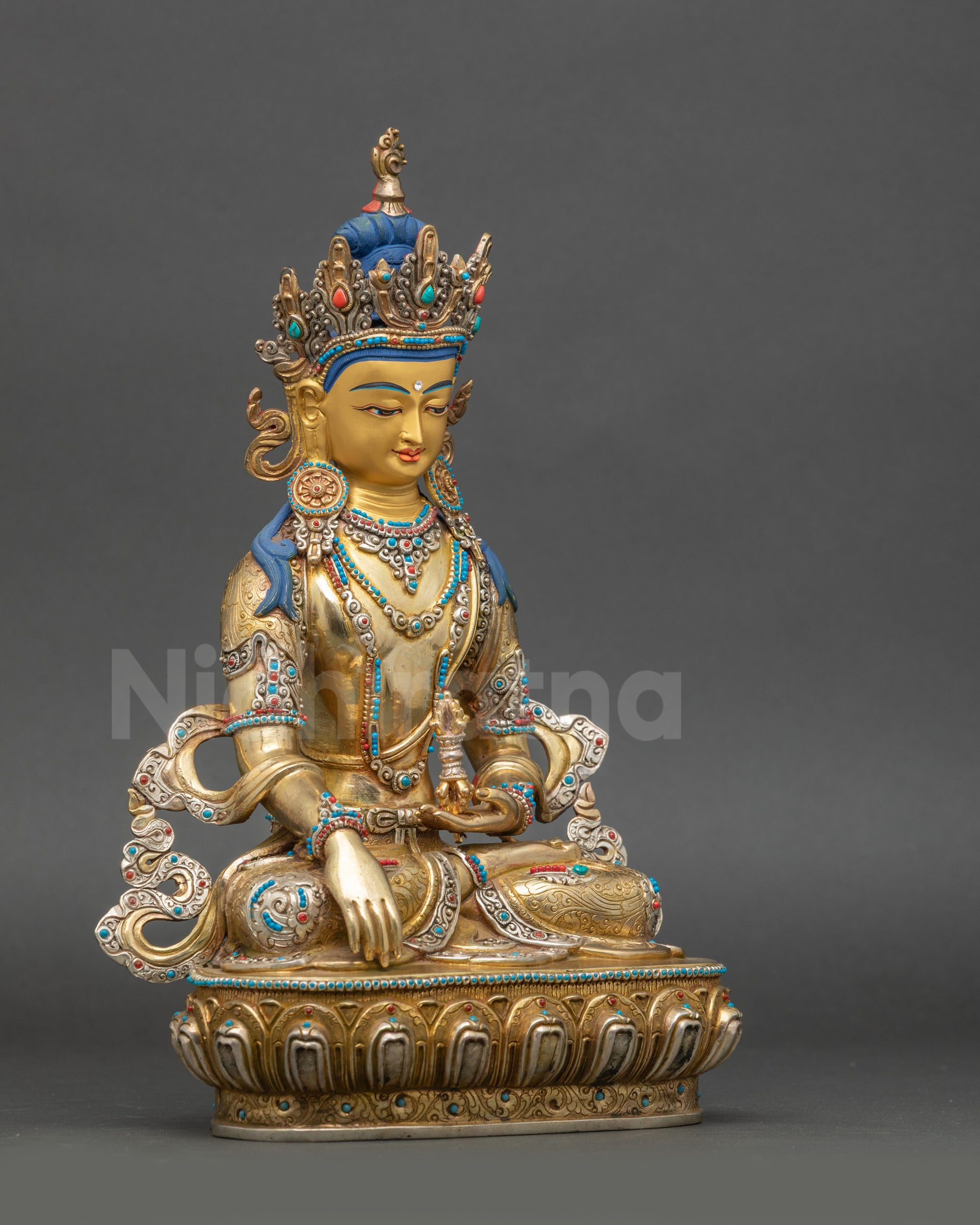 Right view side of Mitrugpa Buddha Statue holding Vajra seated on lotus seat