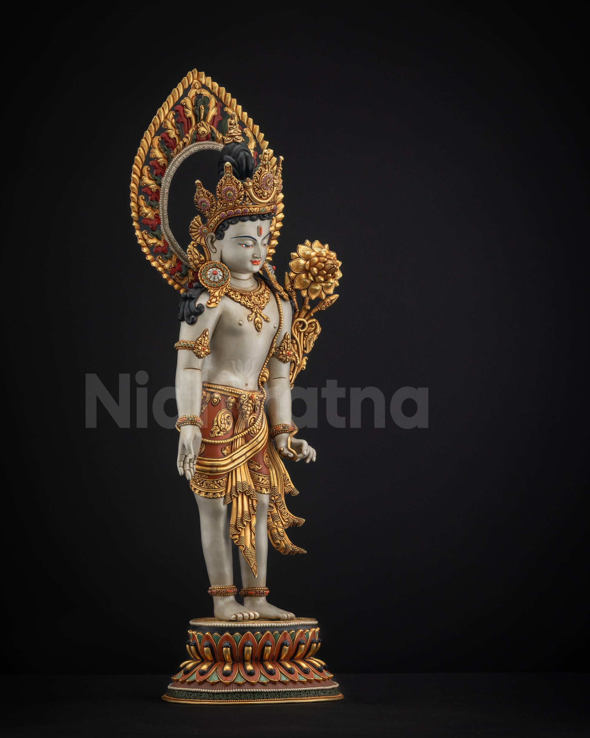 Right view side of Padmapani Lokeshvara statue holding flower beside shoulder