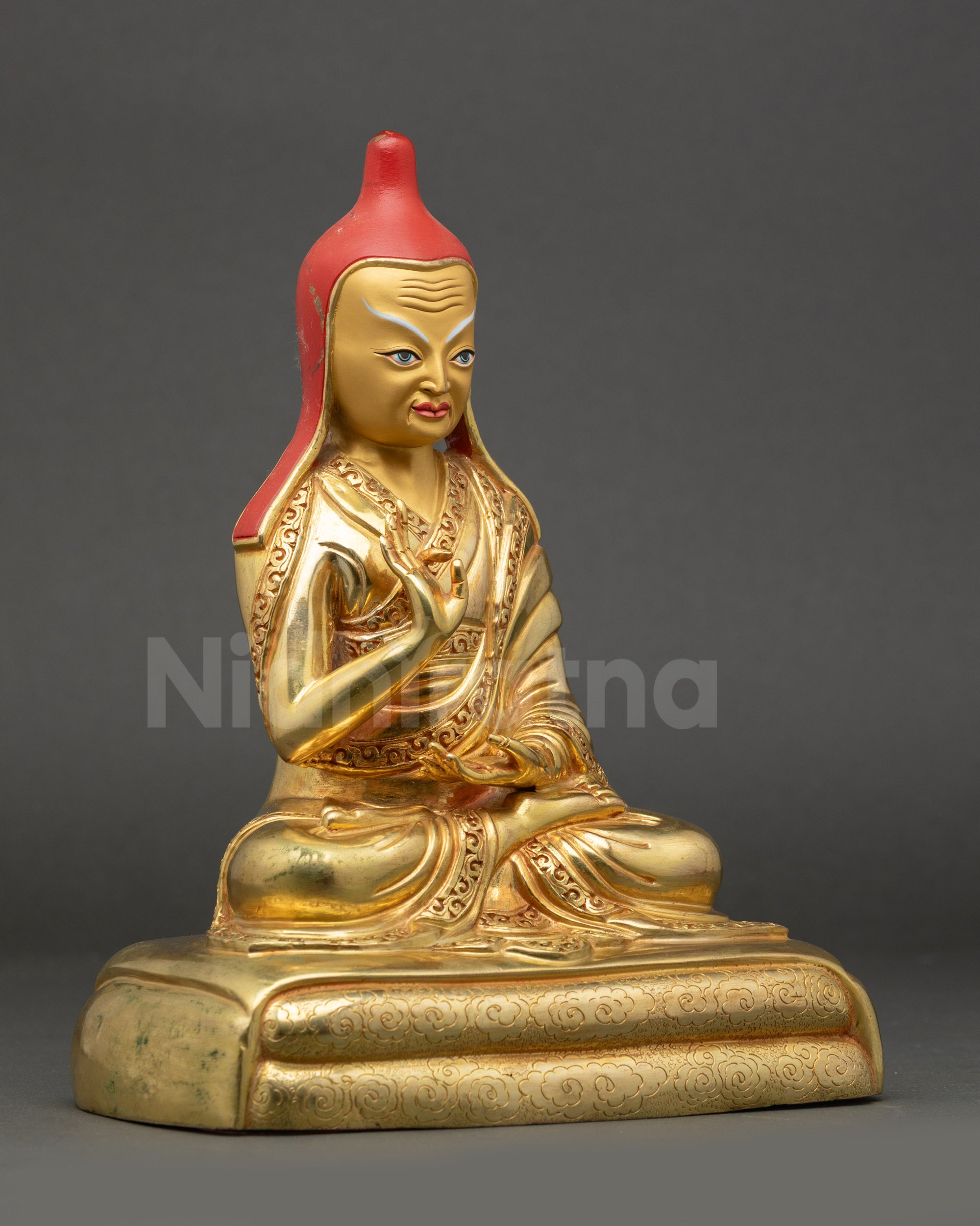 Right view side of Santarakshita holding Vajrayana texts