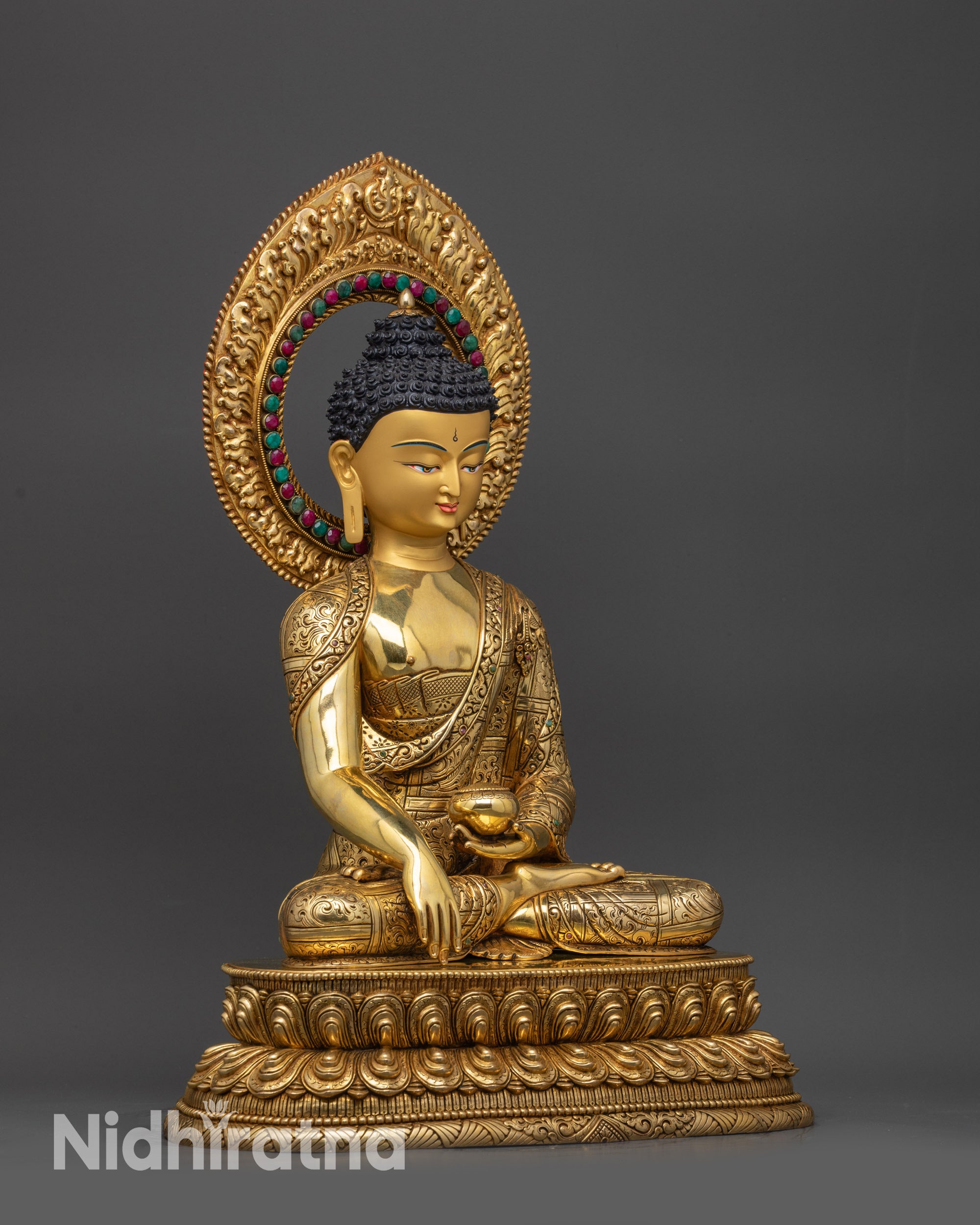 Right view side of Shakyamuni Buddha statue with alms bowl and lotus base