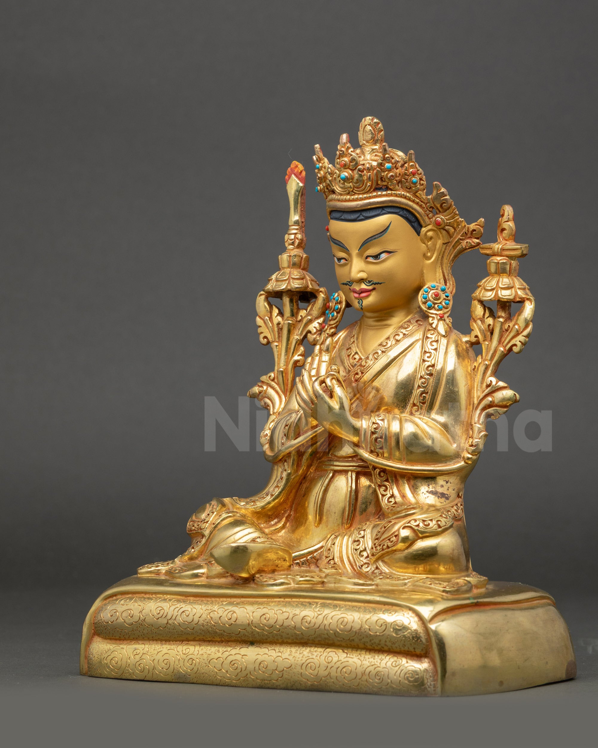 Right view side of Trisong Detsen holding dharma wheel