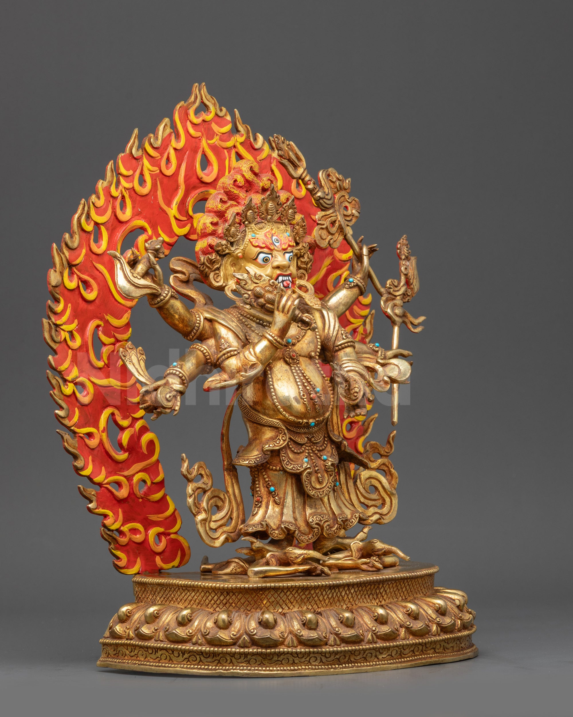 Right view side of White Mahakala statue highlighting kapala and kartika knife