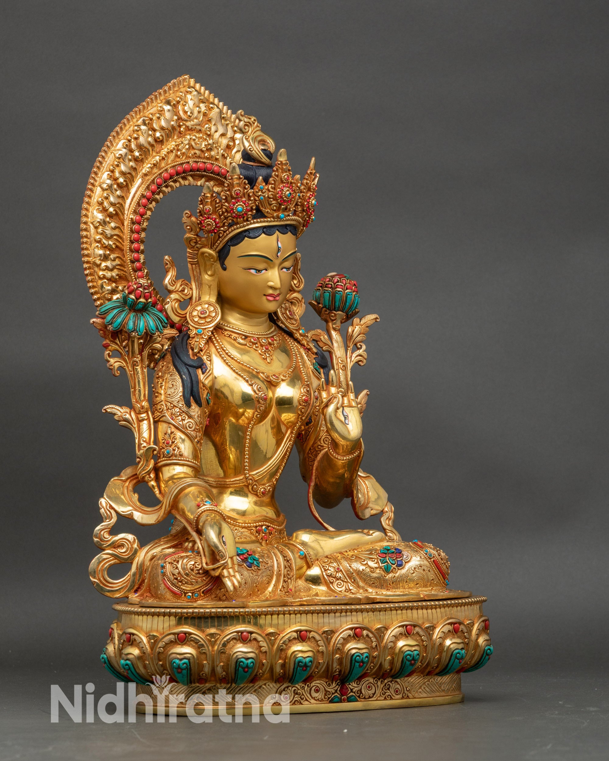 Right view side of White Tara statue displaying Varada and Vitarka mudras