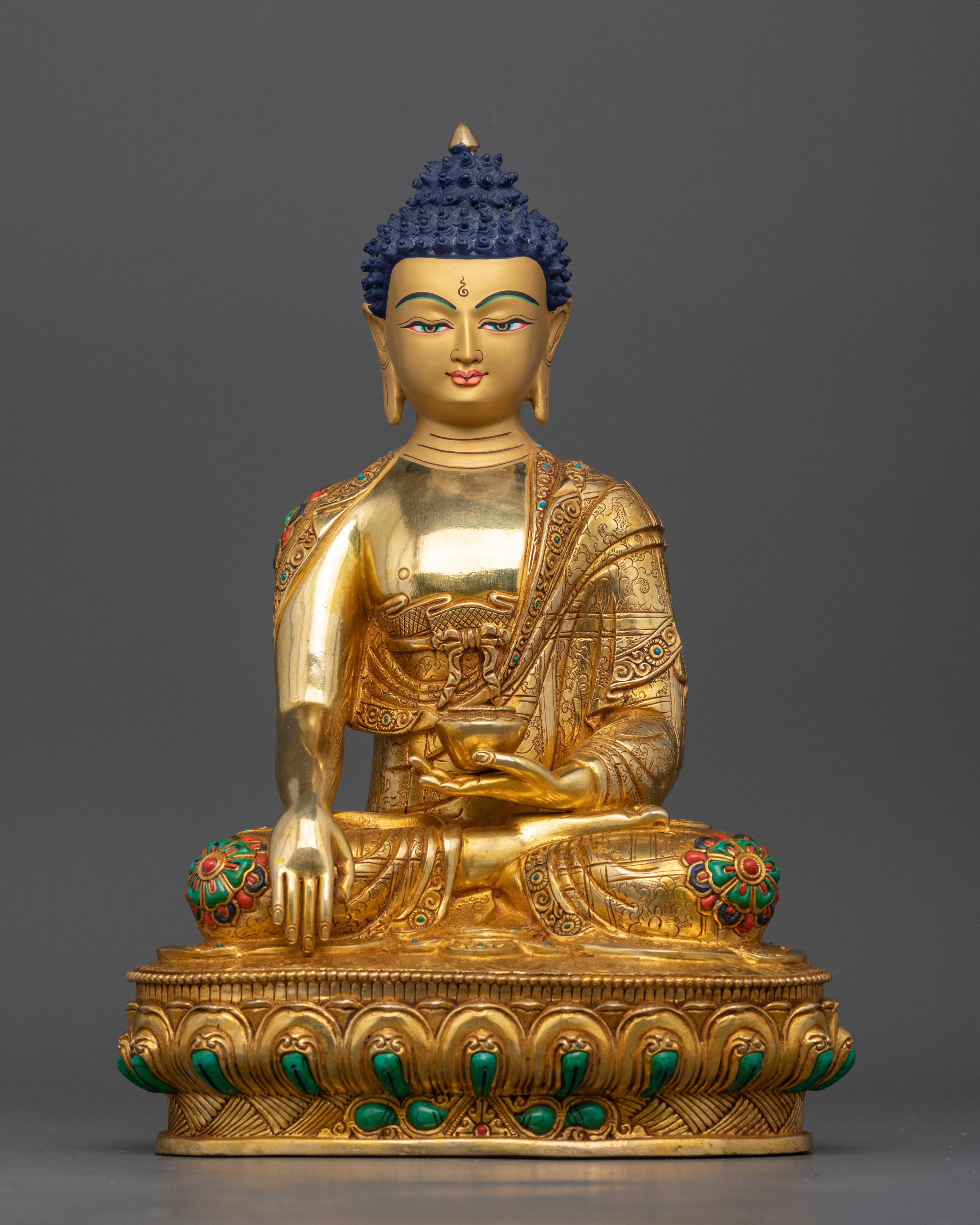 Sakyamuni Buddha Sculpture, handcrafted in Nepal with gold painted face and lotus pose