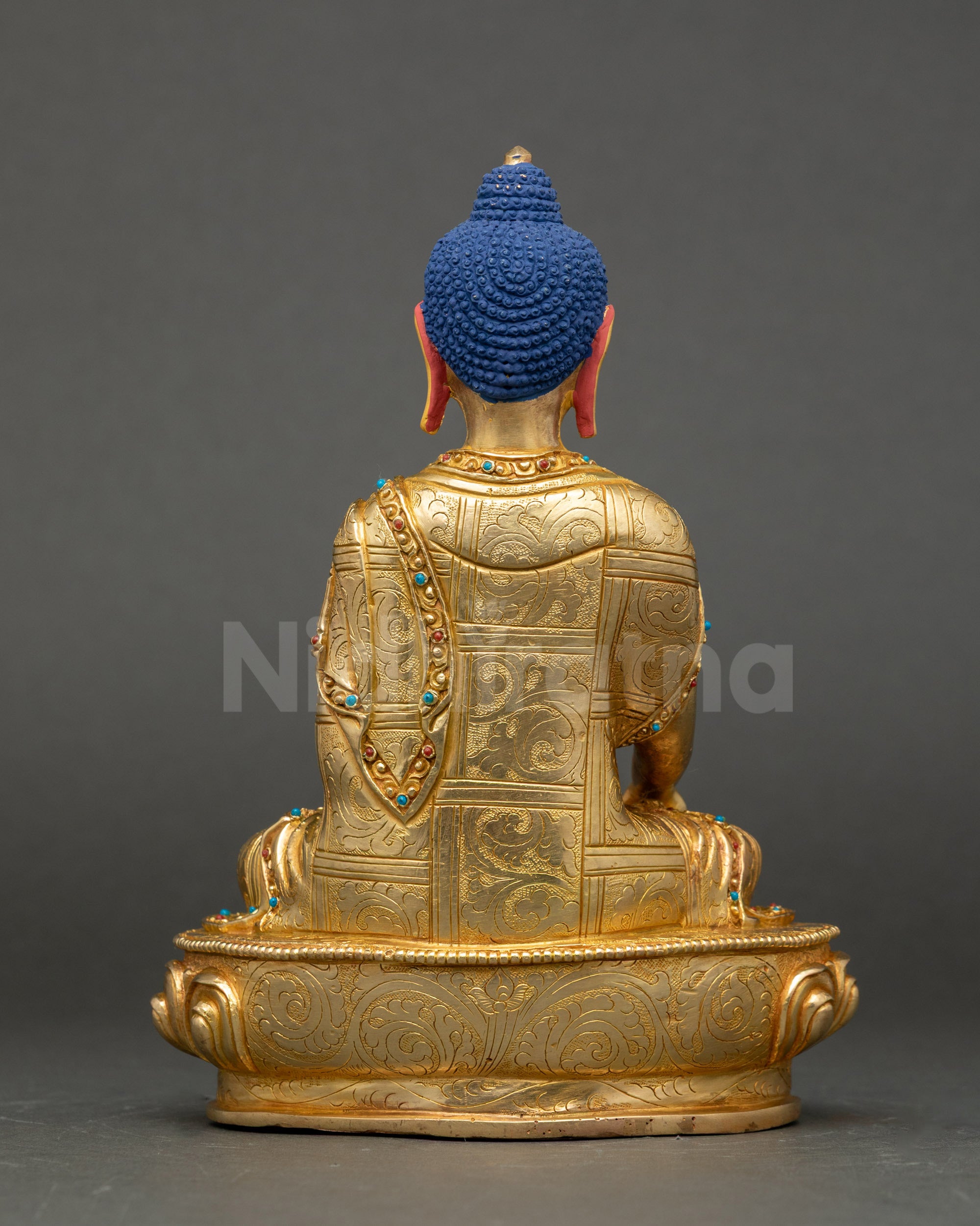 Sakyamuni Buddha back view showing carved robes and traditional Nepalese design