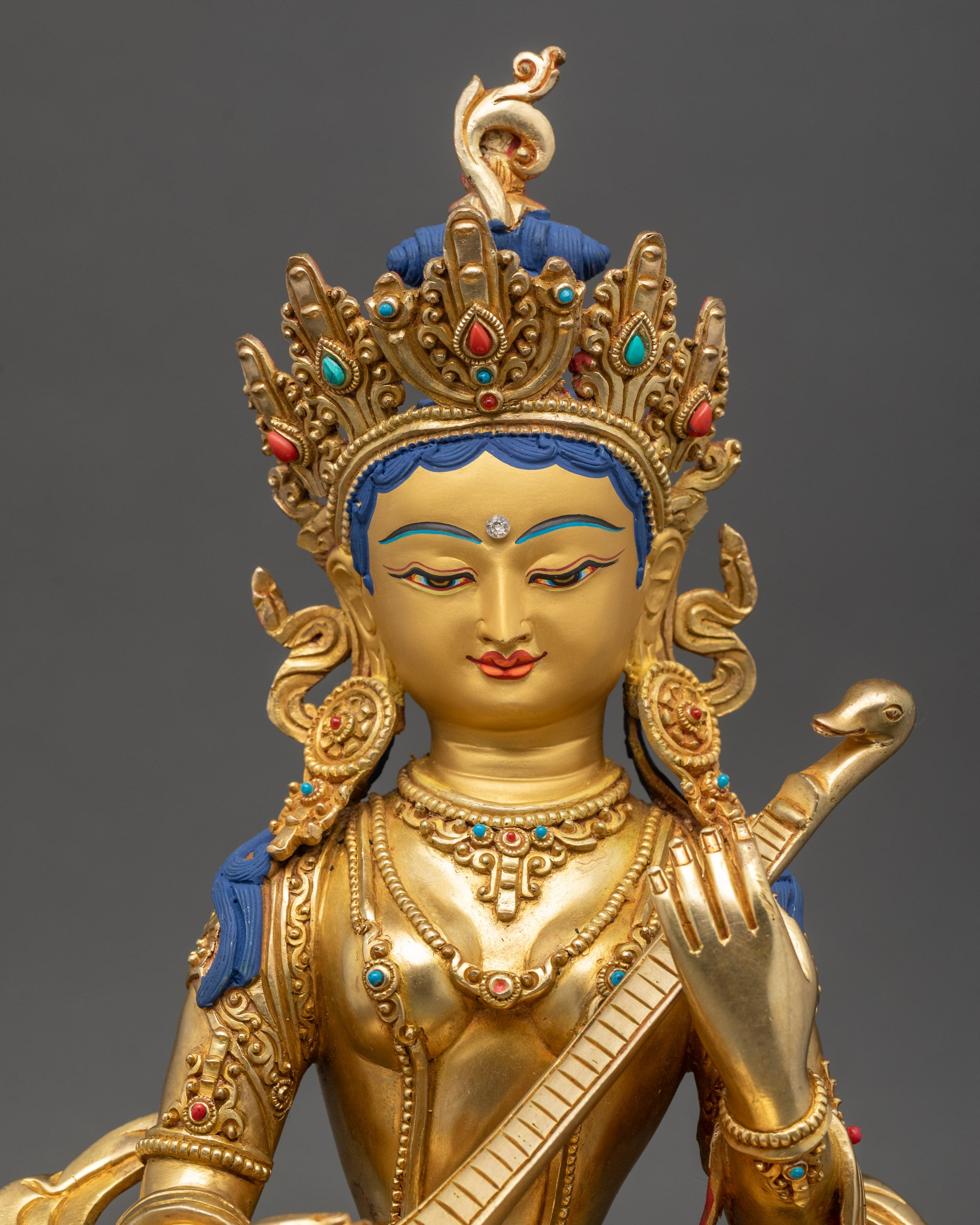 Saraswati statue regular close up showing veena and ornate jewelry with semi-precious stones