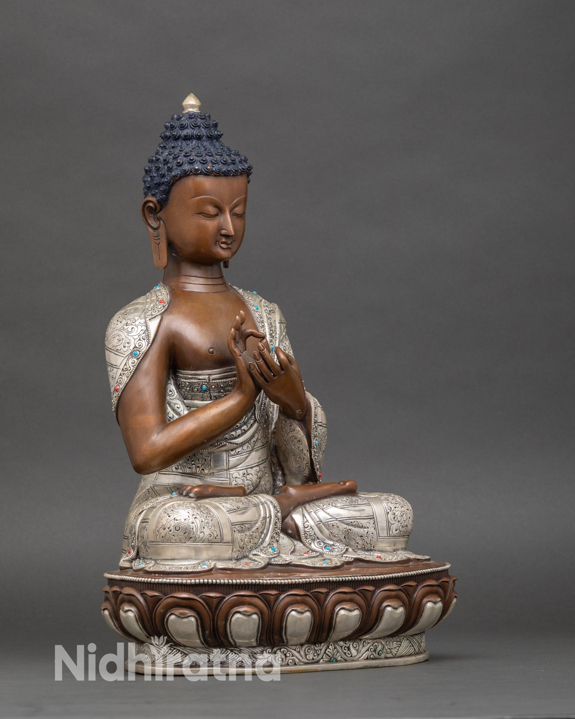 Seated Vairocana Buddha on lotus seat, oxidized copper Himalayan meditation statue from Nepal