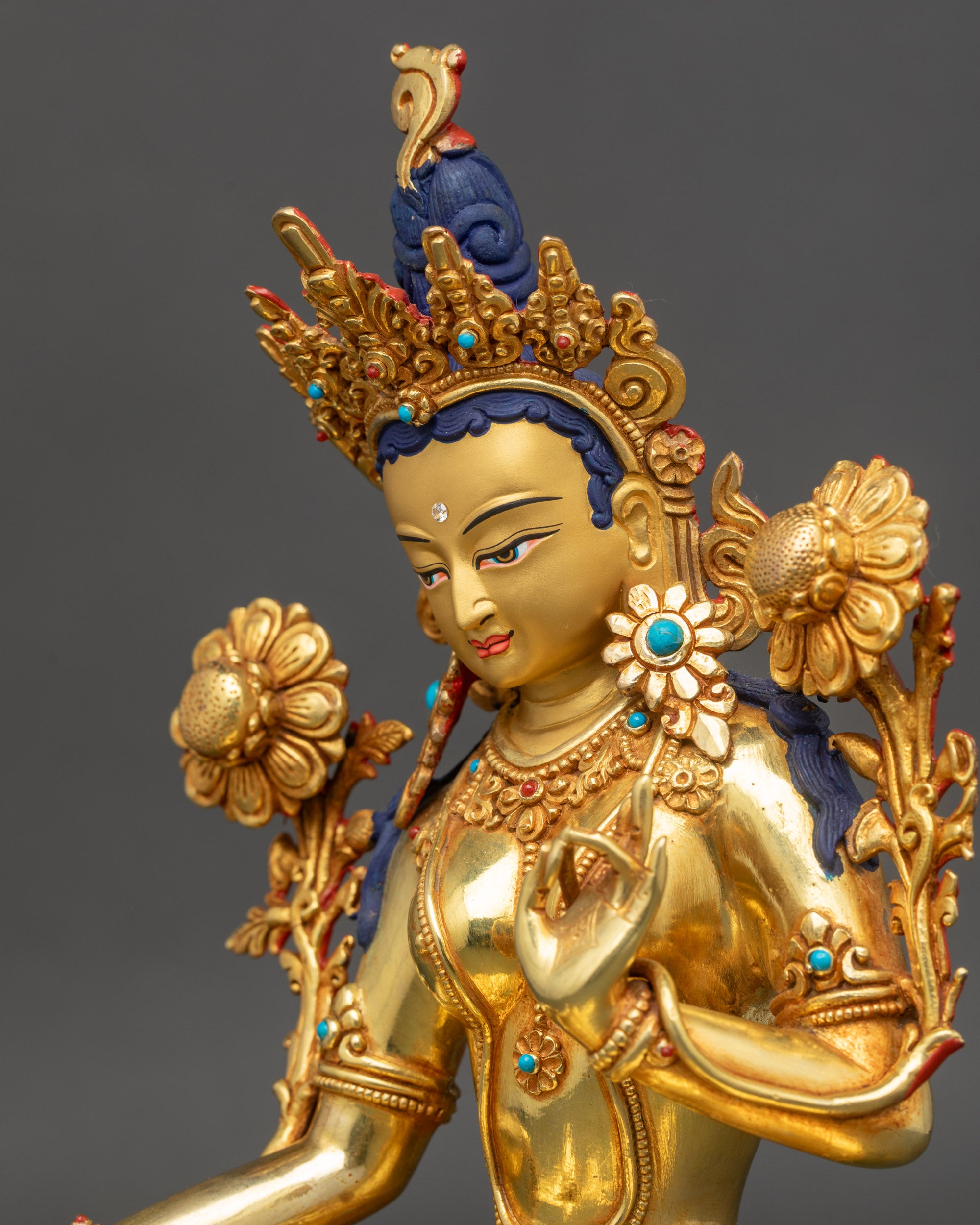 Serene Mother Green Tara Statue detailed close up face with tranquil expression and serene gaze