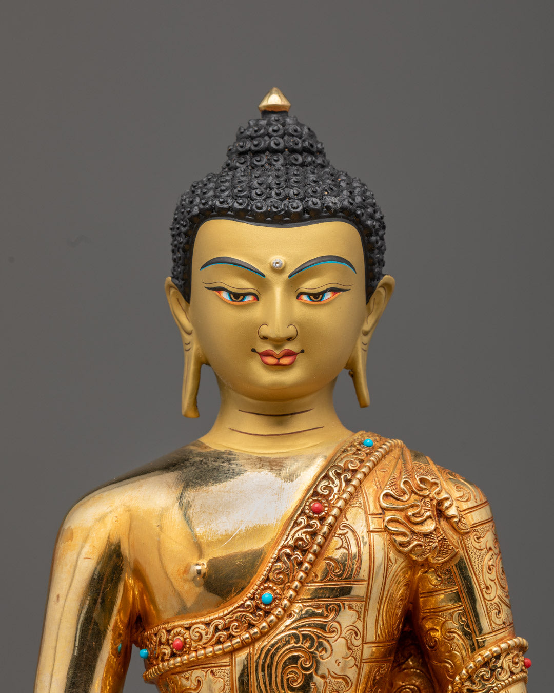 Serene golden face of Amitabha Buddha with intricate halo design, symbolizing infinite light