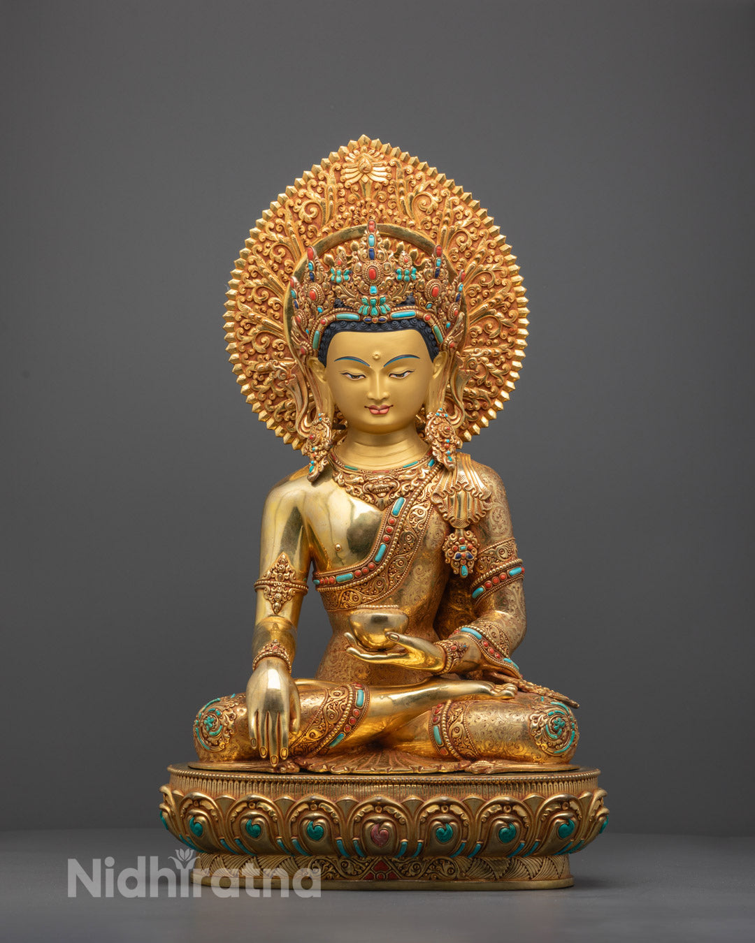 Hand-carved Shakyamuni Buddha statue made of copper with 24k gold fire-gilding and yellow acrylic accents, crafted by Nepalese artisans.