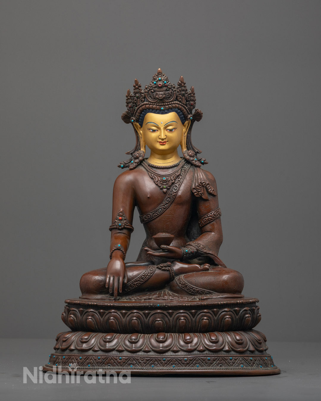 Front view of Oxidized Crowned Shakyamuni Buddha statue with 24K gold-gilded face