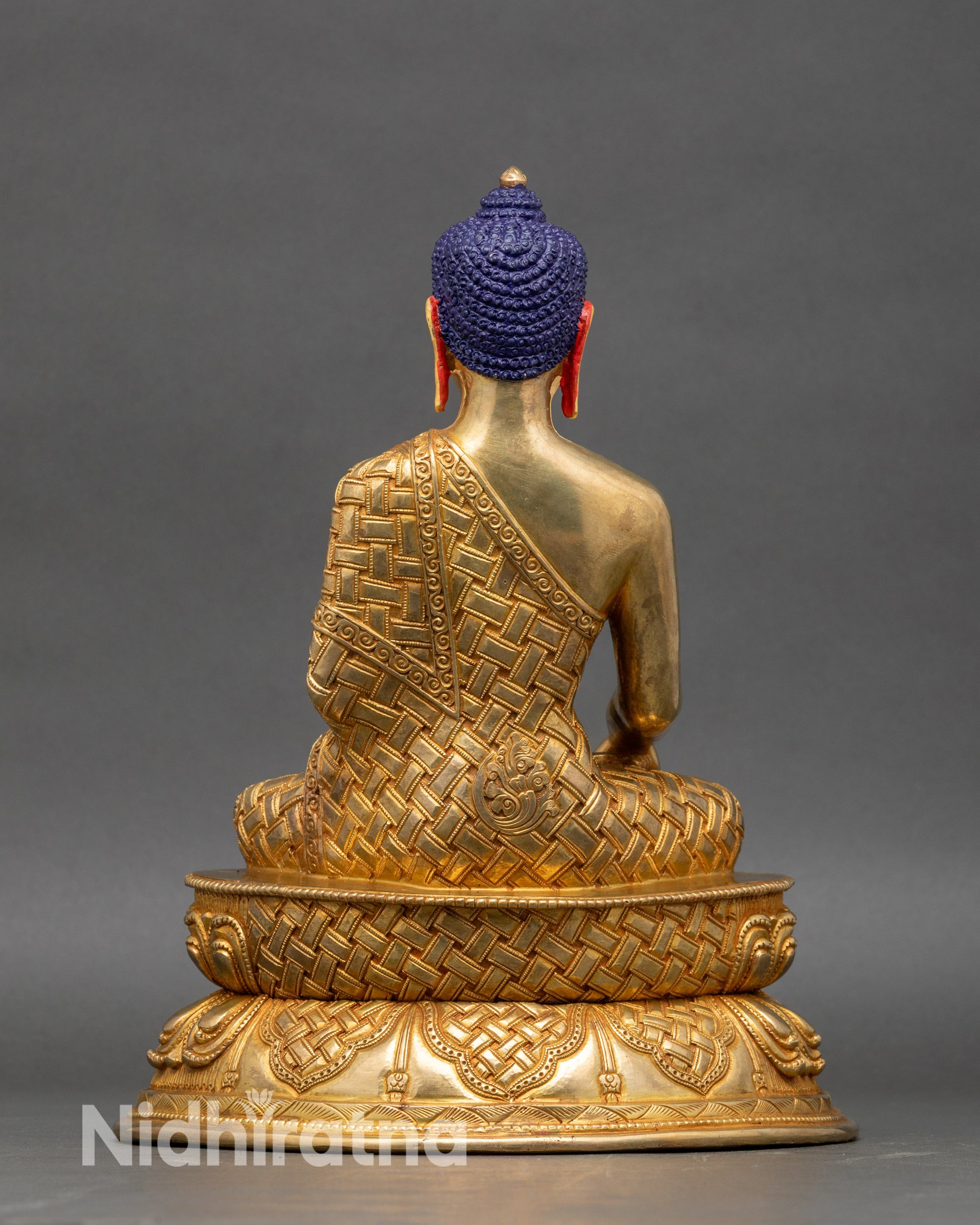 Back view of Shakyamuni Buddha statue, fire-gilded copper, intricate lotus base and handcrafted Nepalese ornamentation