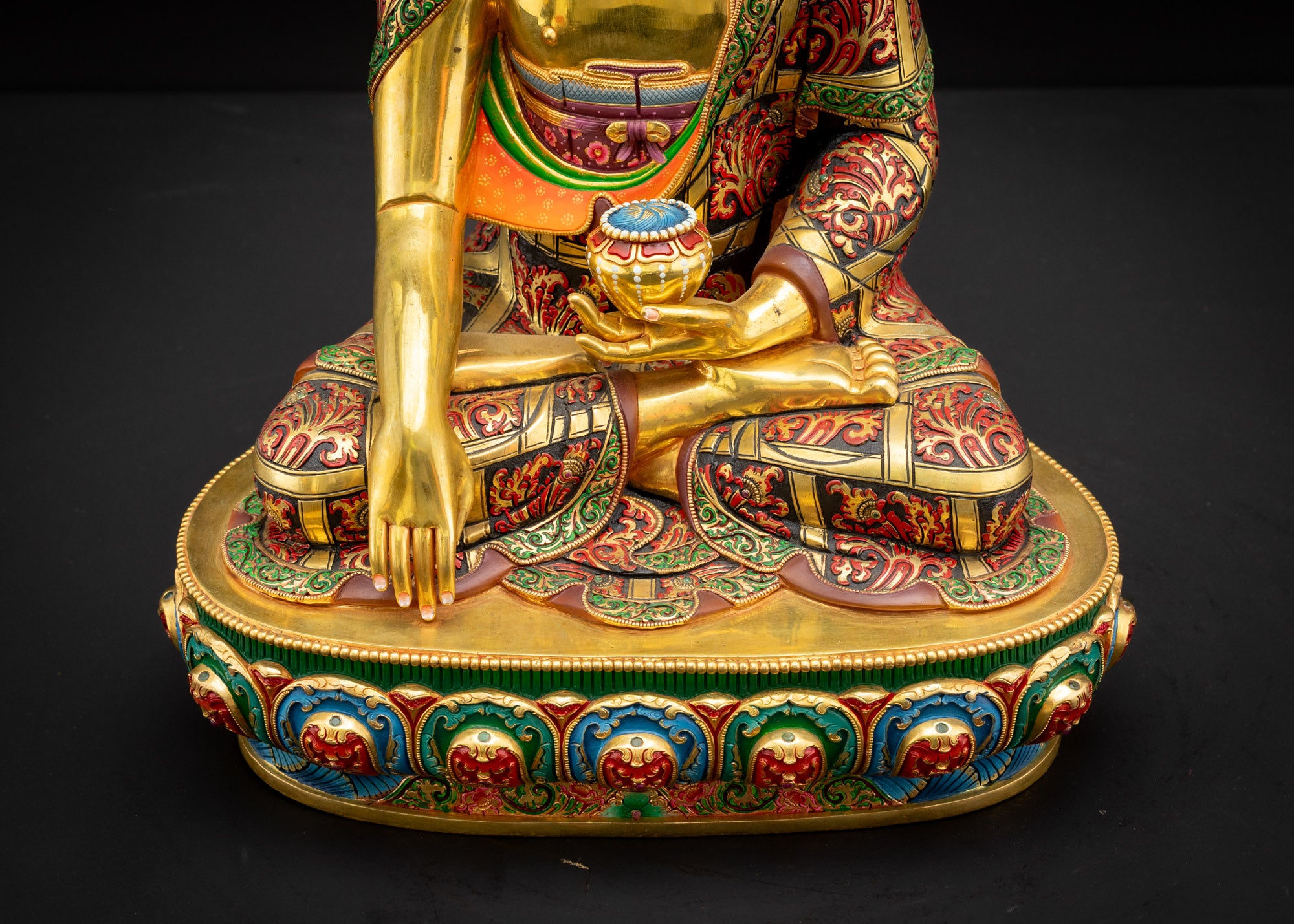 Lower landscape front view of Shakyamuni Buddha Statue highlighting detailed lotus seat and flowing monastic robe