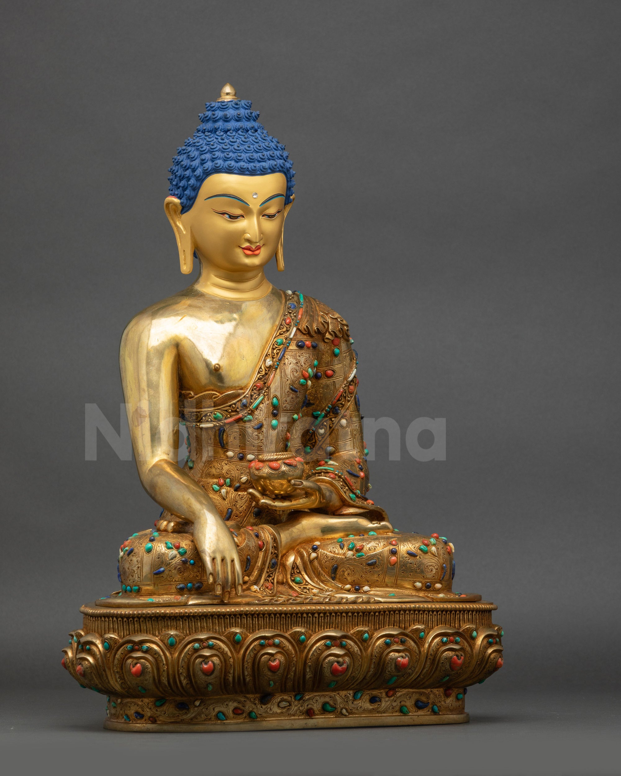 Right side view of Shakyamuni Buddha statue with lotus seat and gold fire-gilded base