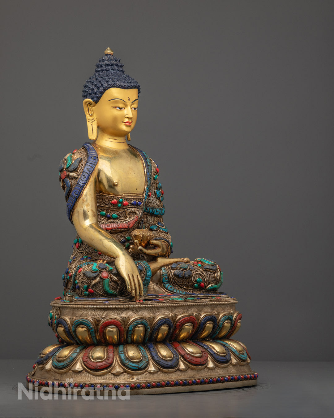 Shakyamuni Buddha Statue showing Patra (alms bowl) and finely carved monastic robe adorned with vibrant acrylic colors