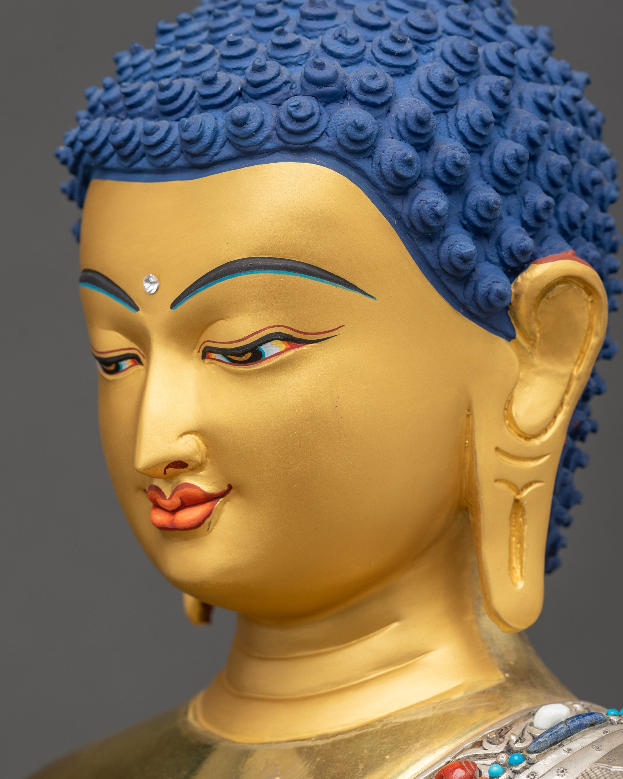 Shakyamuni Buddha Statue side close up face calm gaze spiritual meditation decor
