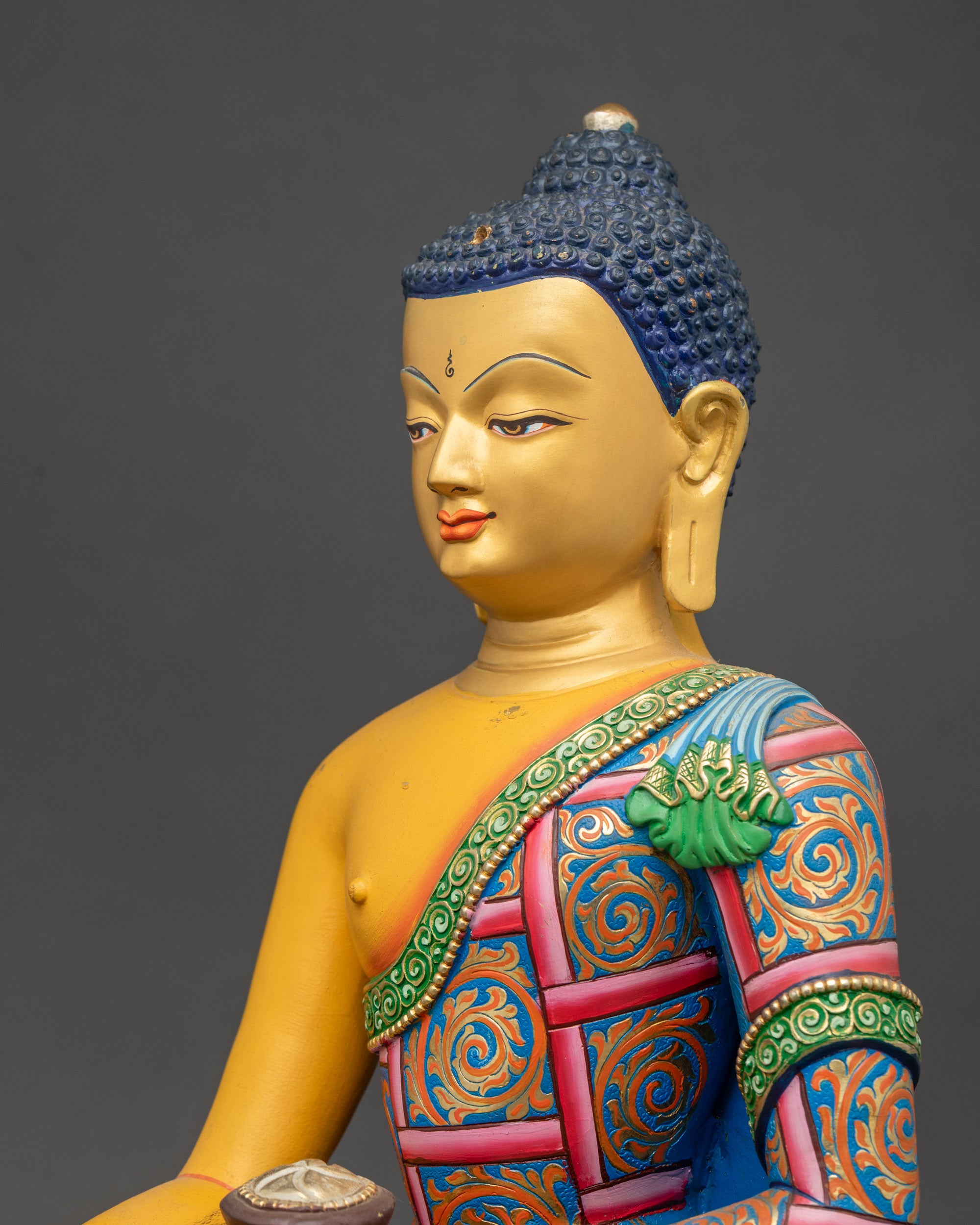 Shakyamuni Buddha Statue side close up showing lotus pedestal and robes